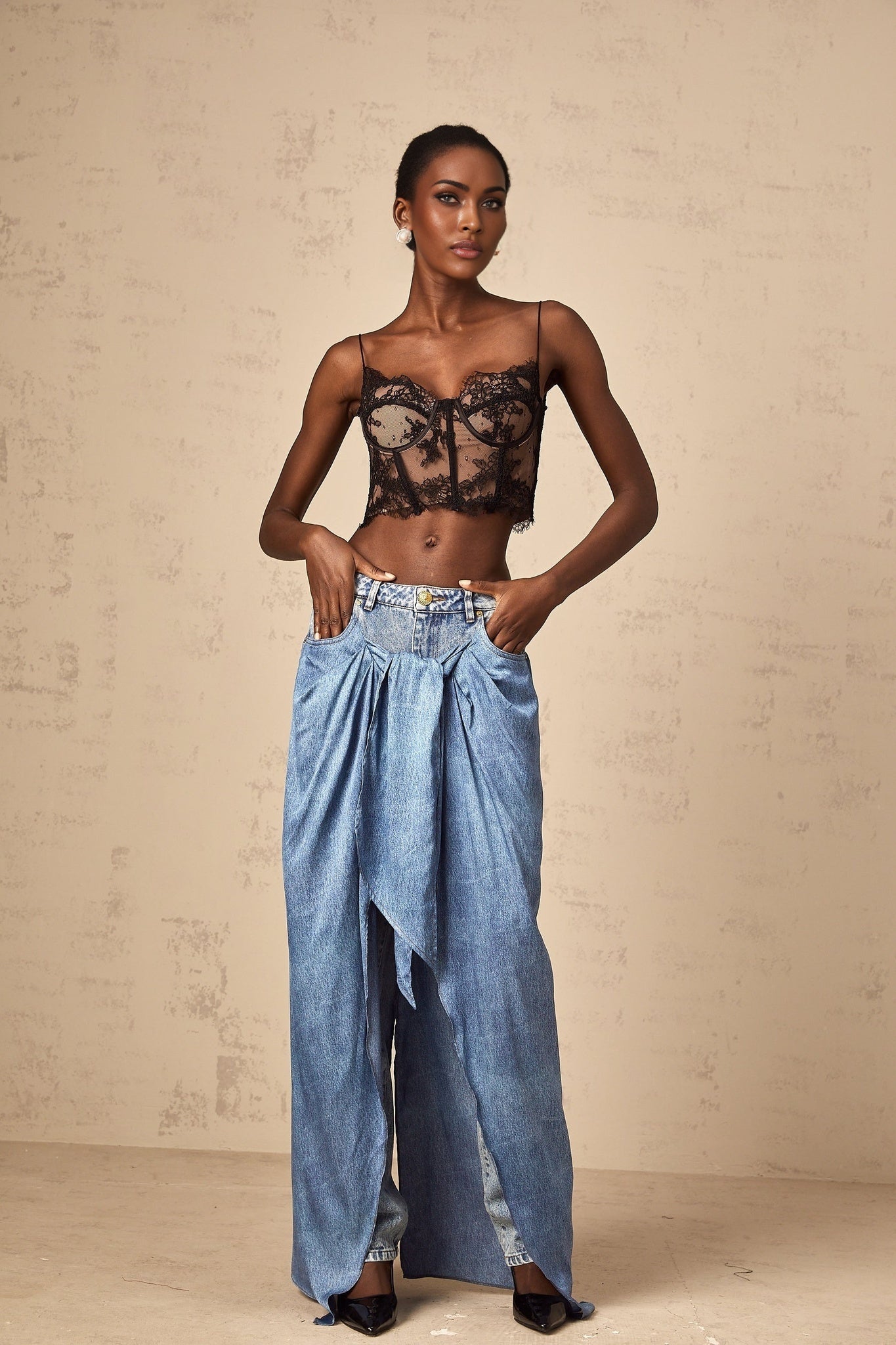 A pair of blue layered denim jeans named Ysabella featuring multiple fabric layers for a stylish and unique look