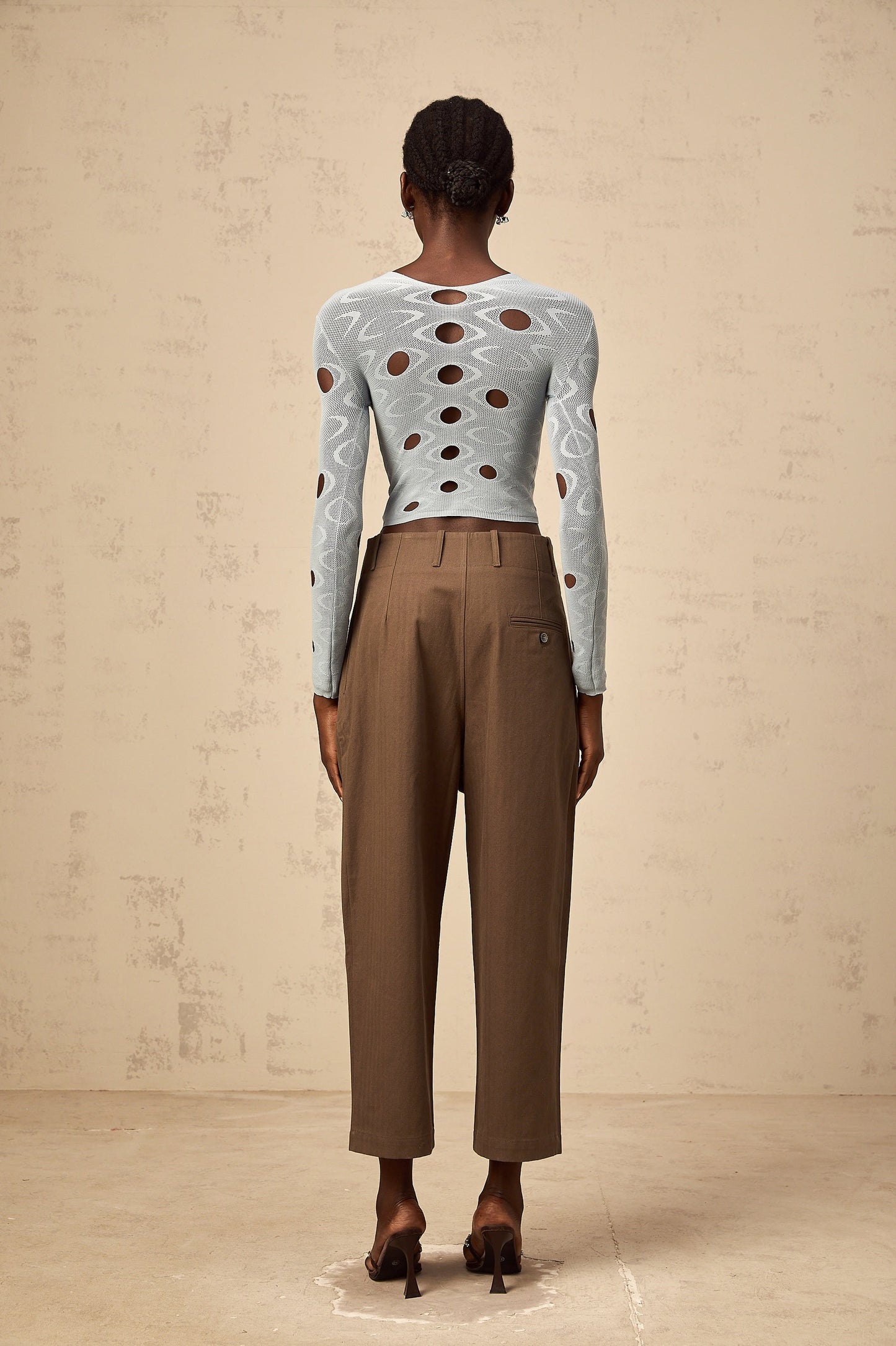 A pair of brown wide leg trousers with shirred detailing and a cropped length named Ophelie