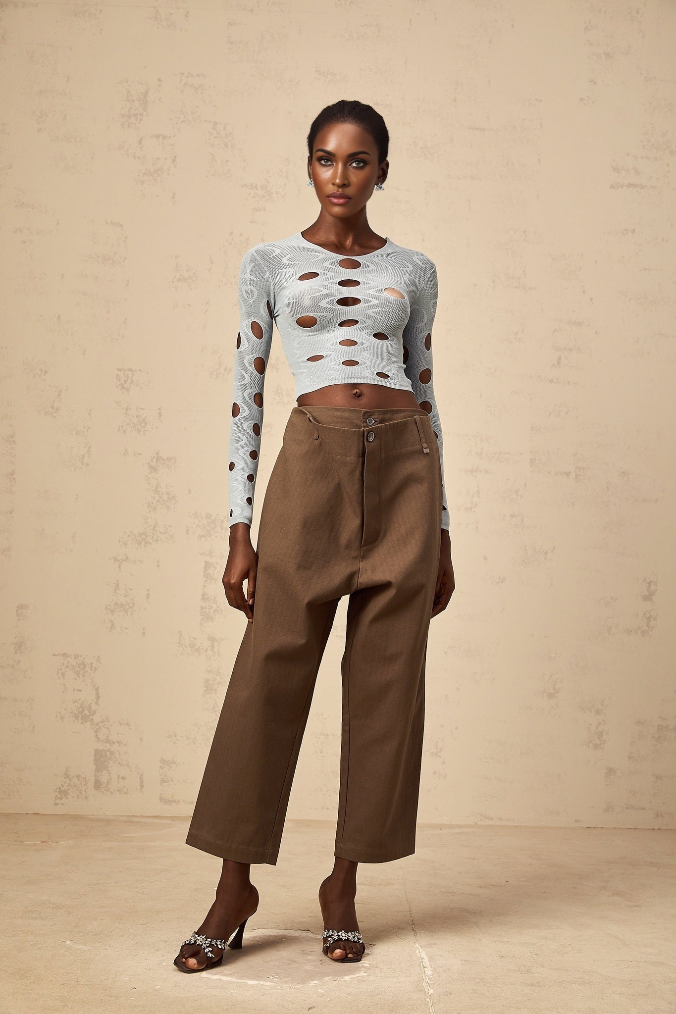 A pair of brown wide leg trousers with shirred detailing and a cropped length named Ophelie