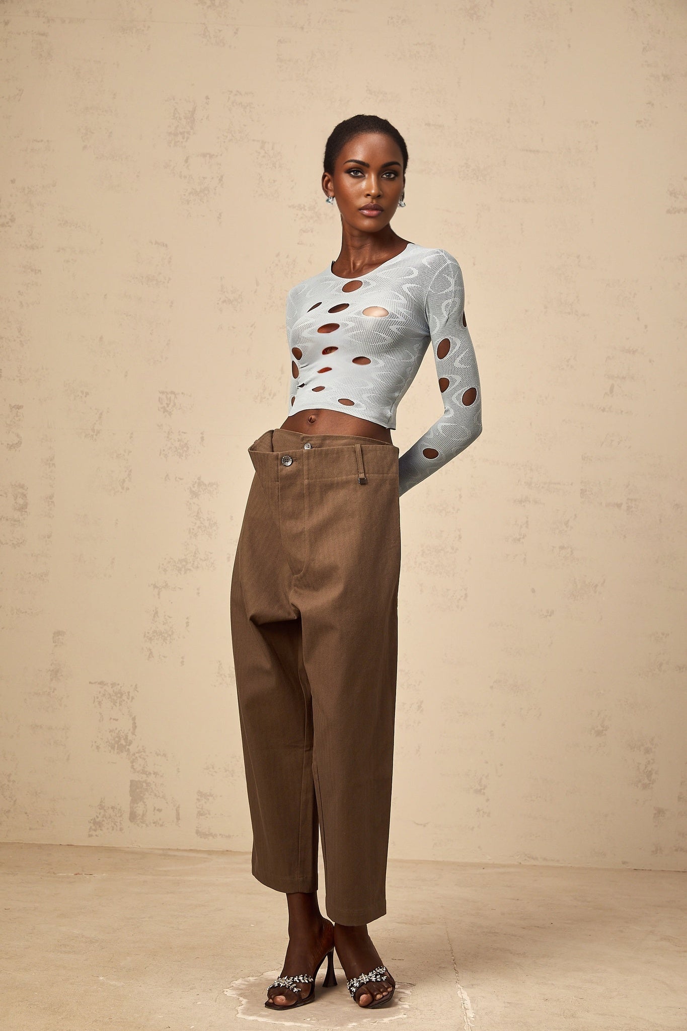 A pair of brown wide leg trousers with shirred waistband and cropped length named Ophelie