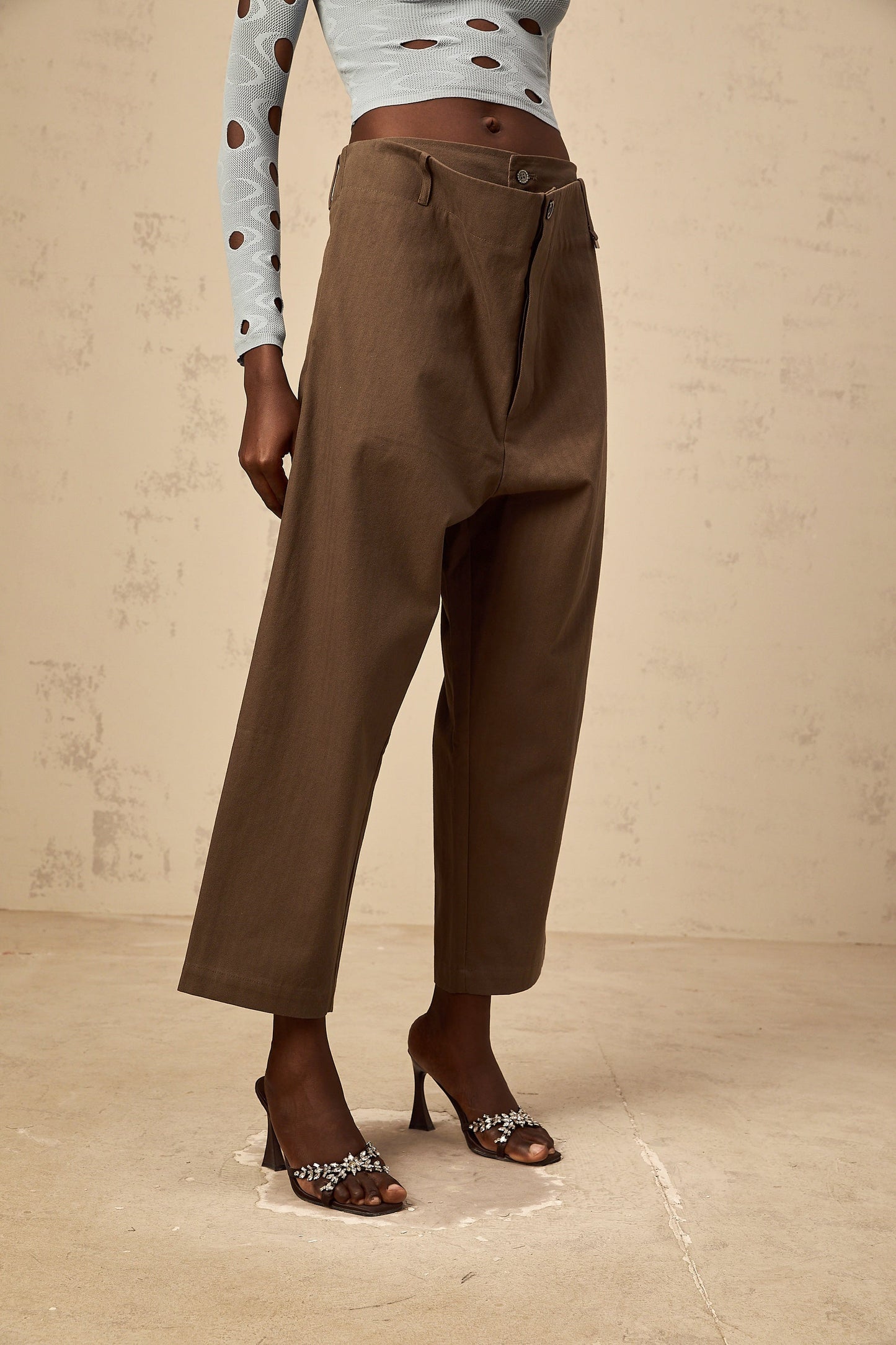 A pair of brown wide leg trousers with shirred waistband and cropped length named Ophelie