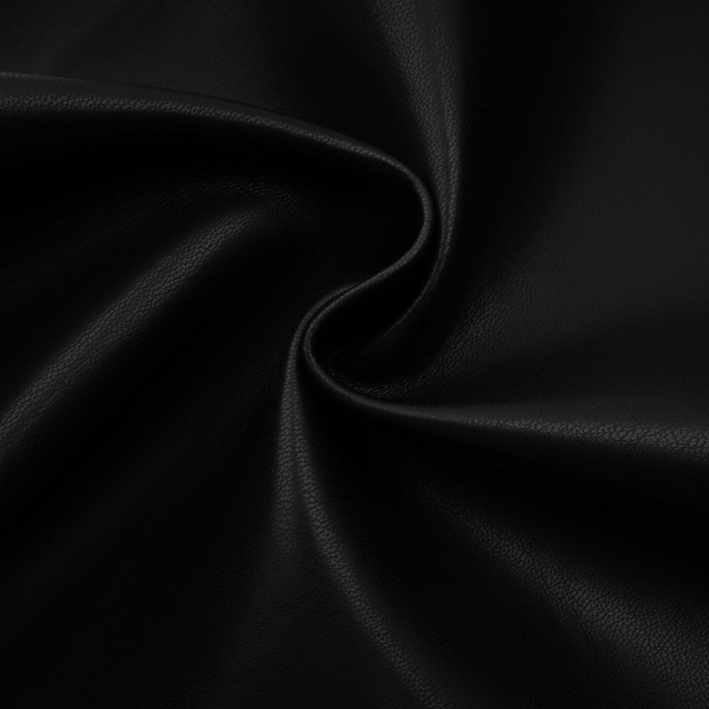 A pair of leather trousers featuring contrasting colors with the name Clotilde