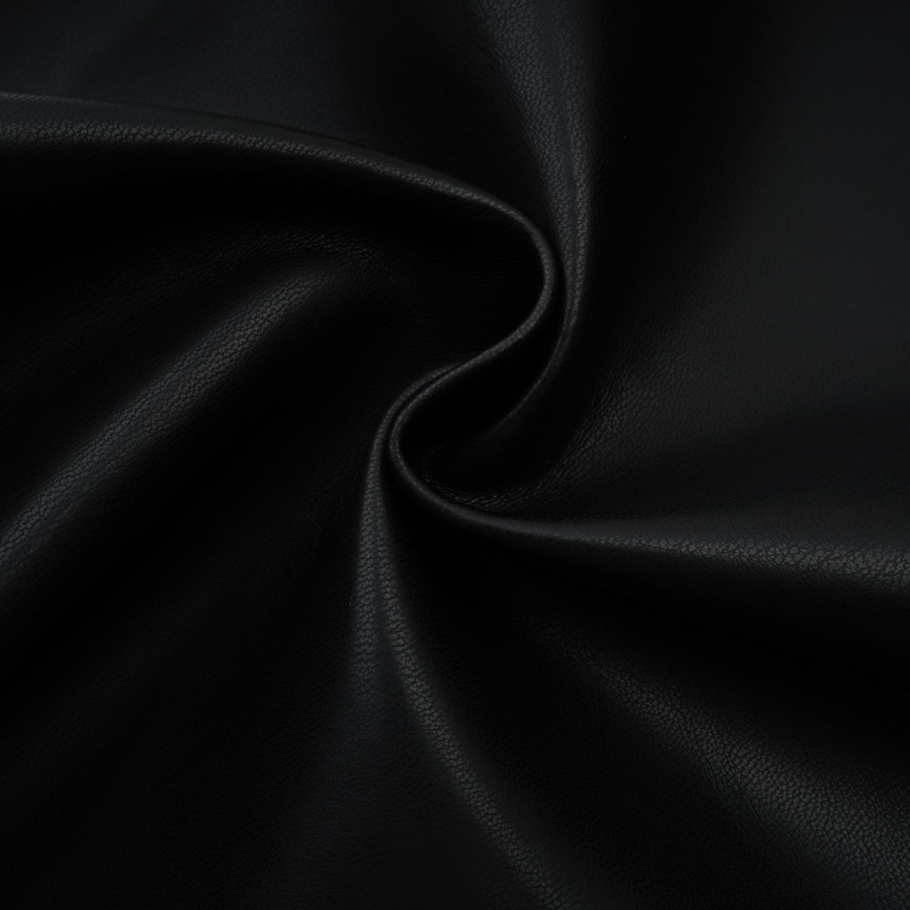 A pair of leather trousers featuring contrasting colors with the name Clotilde