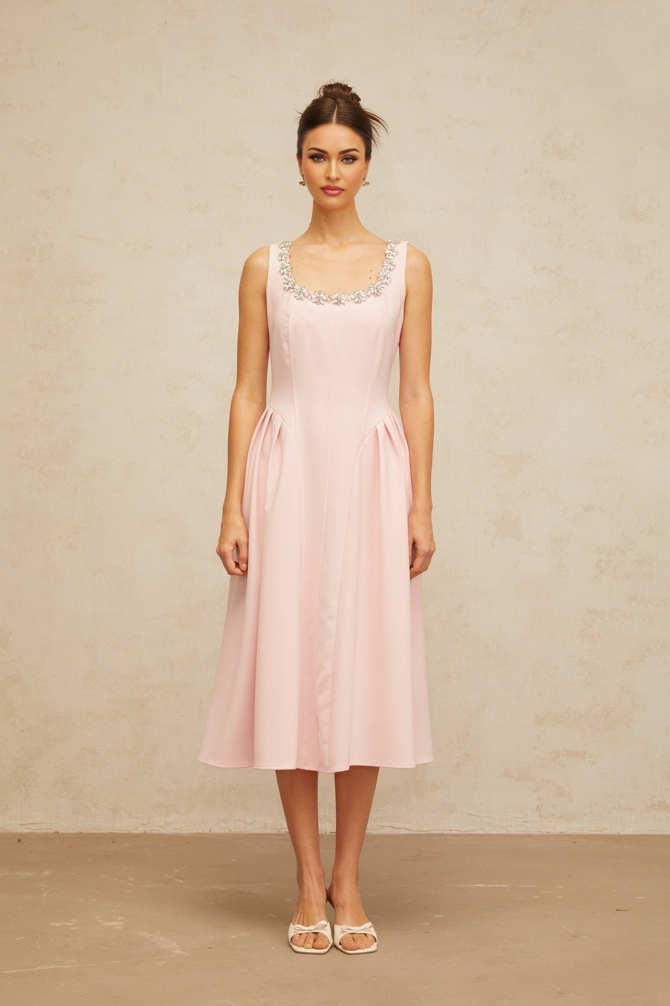 A pink crystal embellished midi dress with pleated details named Beatrice