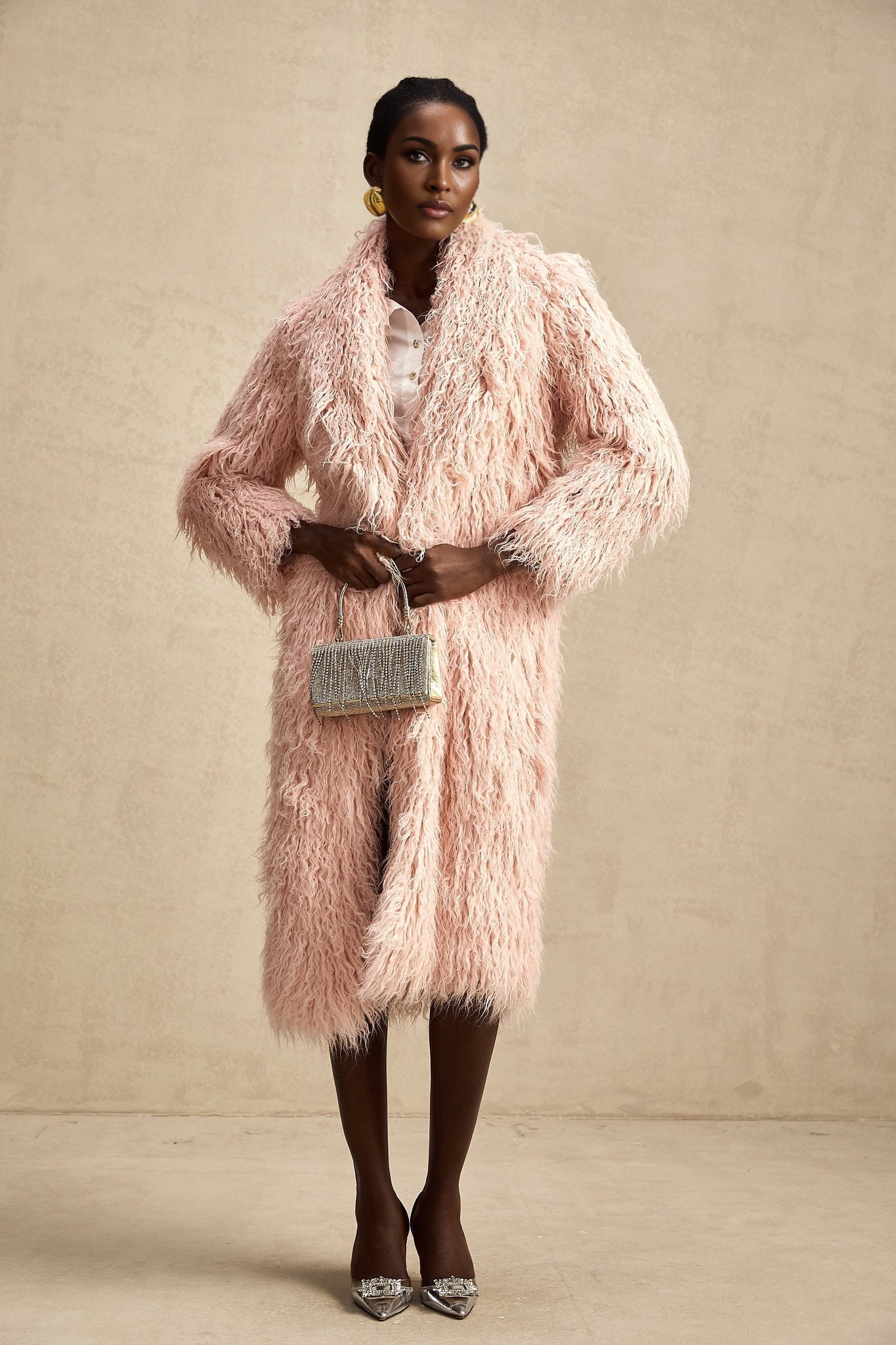 A pink faux fur coat with an open front design named Melanie
