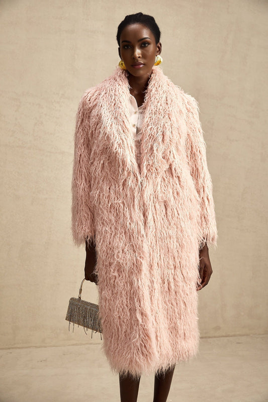 A pink faux fur coat with an open front design worn by a model against a plain background