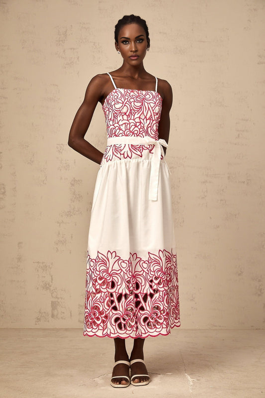 A pink midi dress with embroidery and cut out details named Béatrice