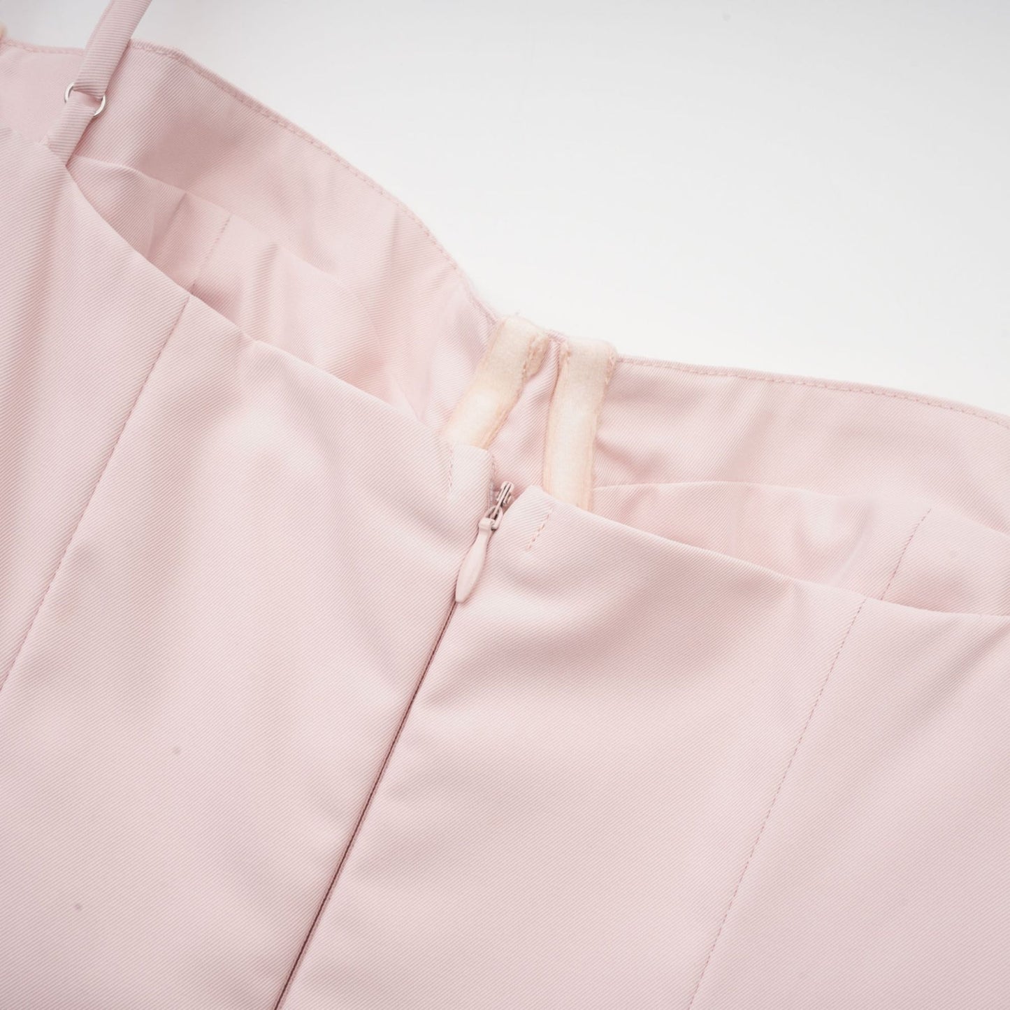 Pink designer dress with sleeveless bustier style pleated flared skirt spaghetti straps and side pockets Midi length in 73% Polyester and 27% Viscose blend for comfort