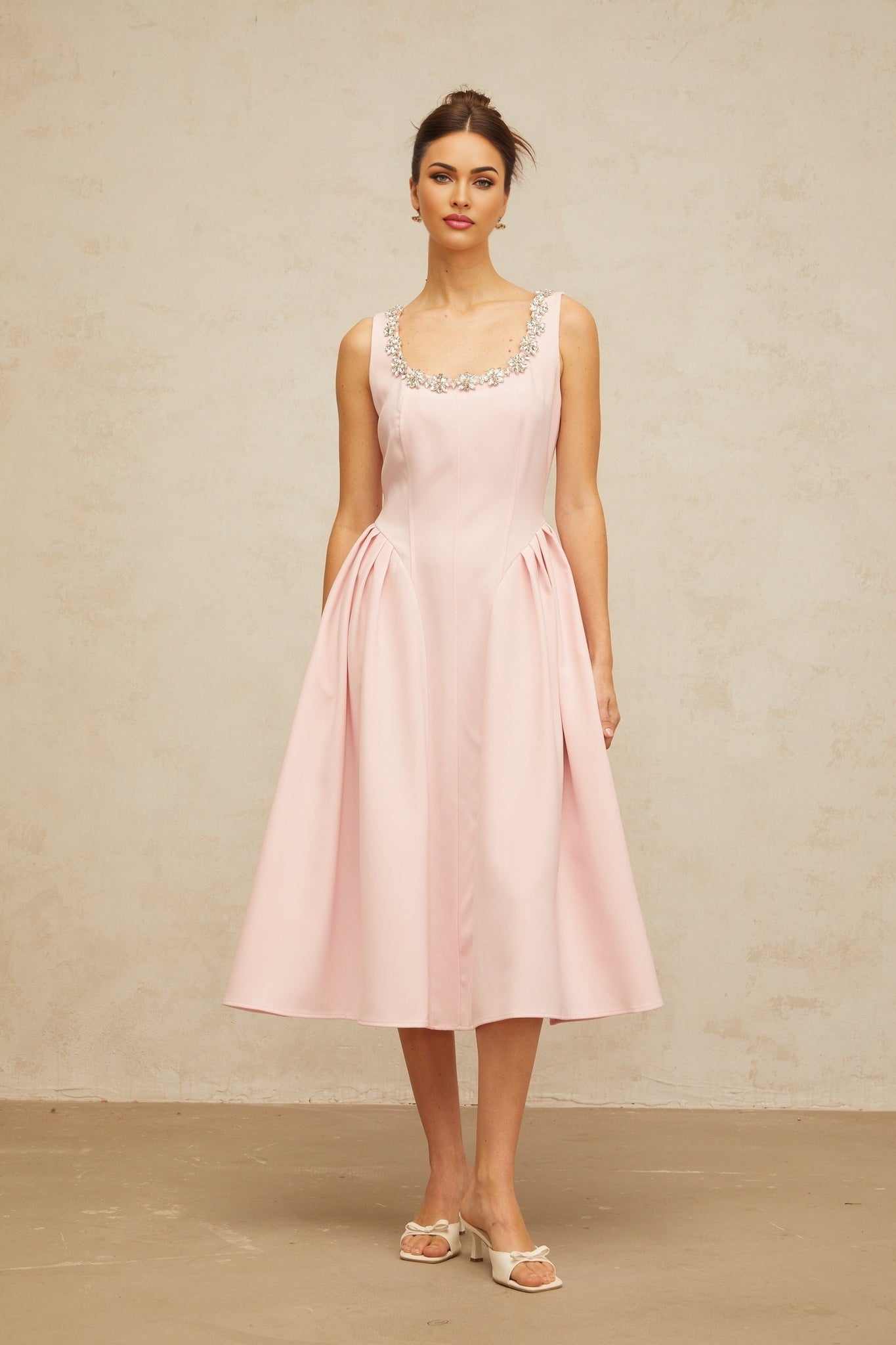 A pink midi dress with pleated details and crystal embellishments named Beatrice