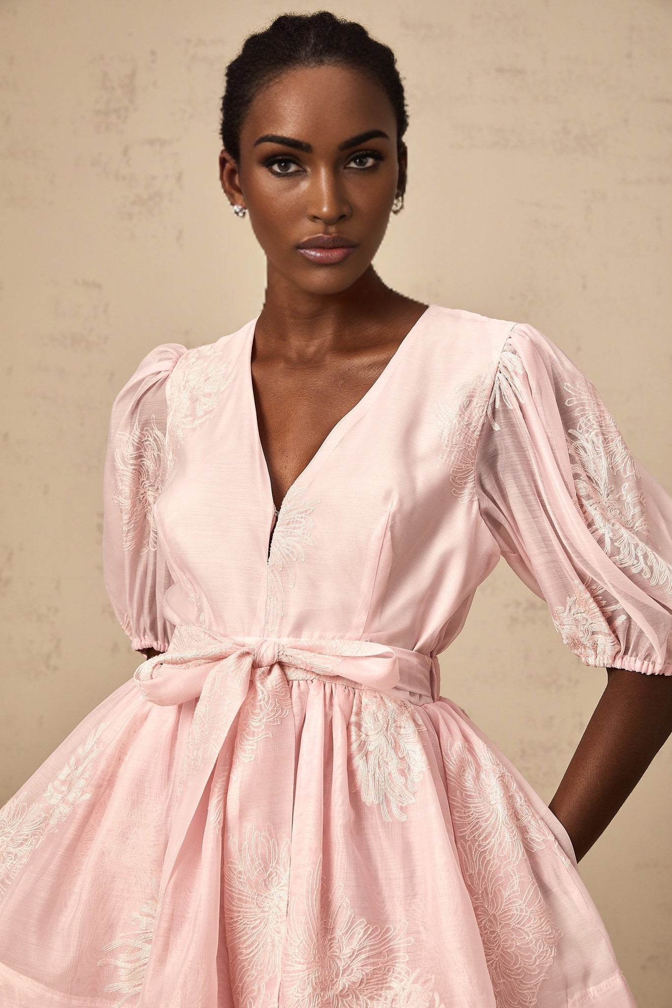 A pink mini dress with floral embroidery and layered design named Florence