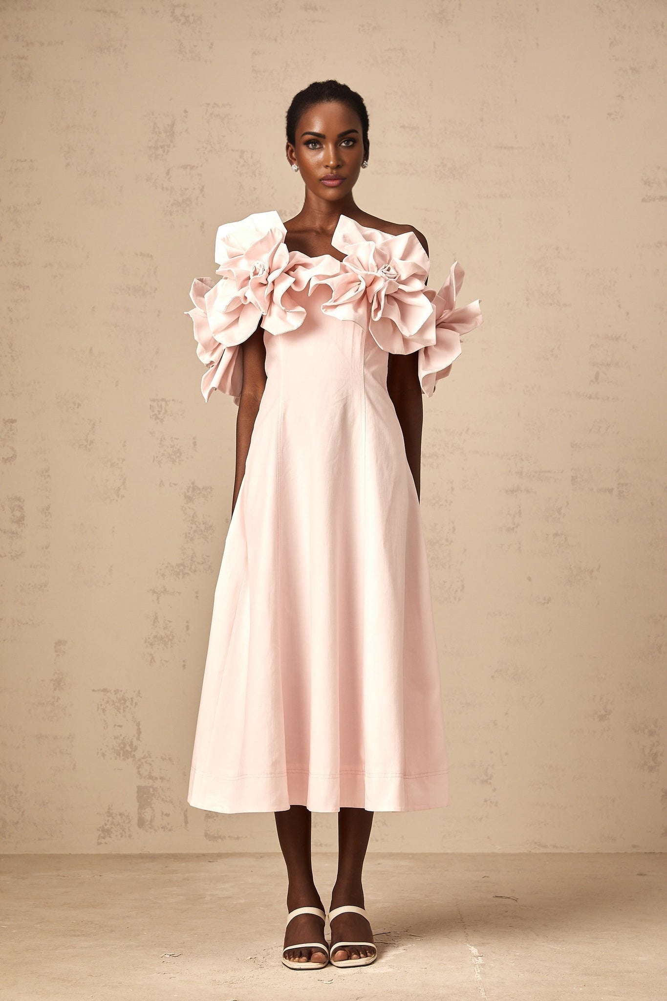 A pink offshoulder midi dress with 3D petal details named Juliette
