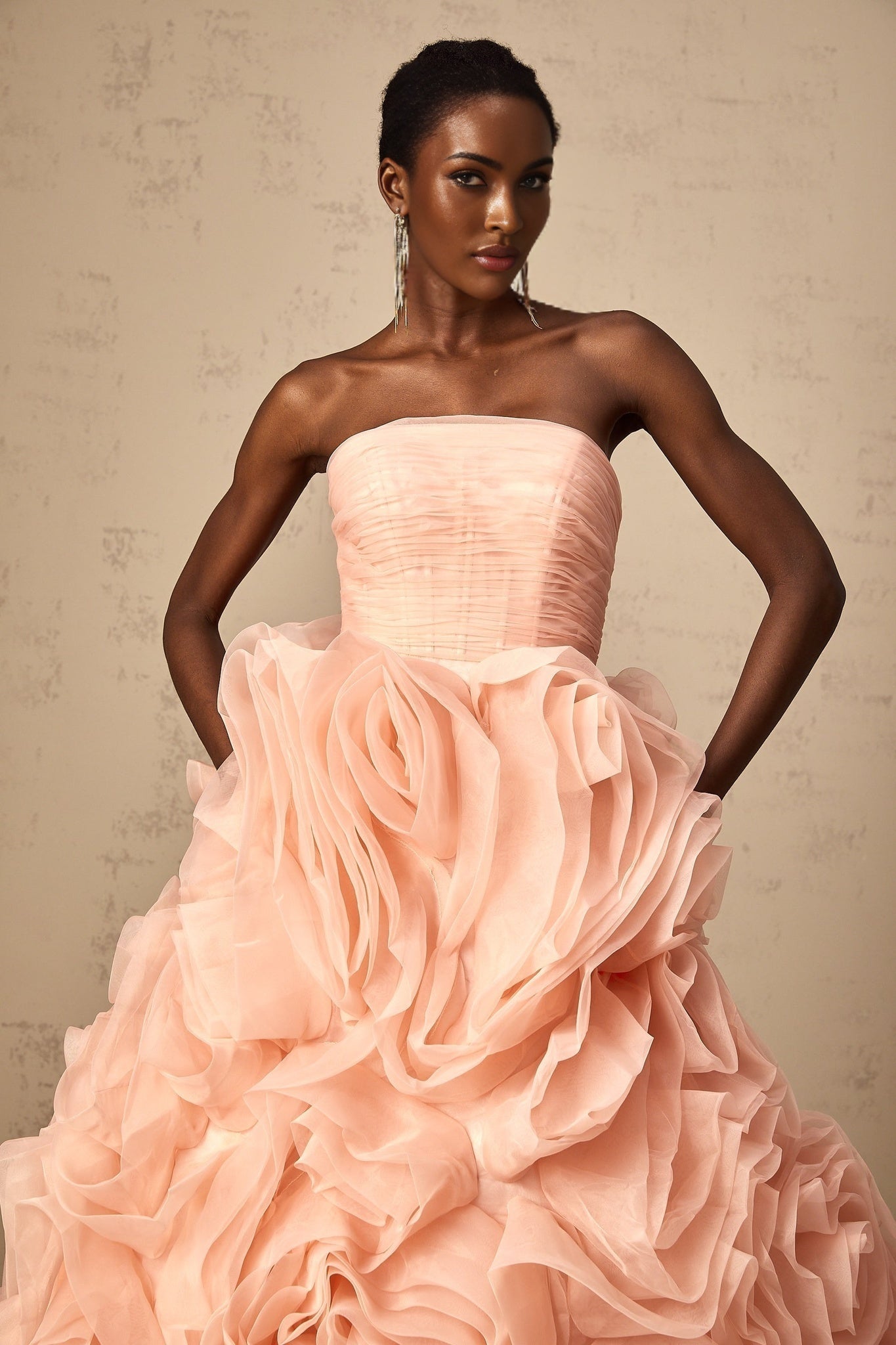 A pink offshoulder midi dress with 3D petal details on tulle fabric featuring a flowy silhouette and delicate design