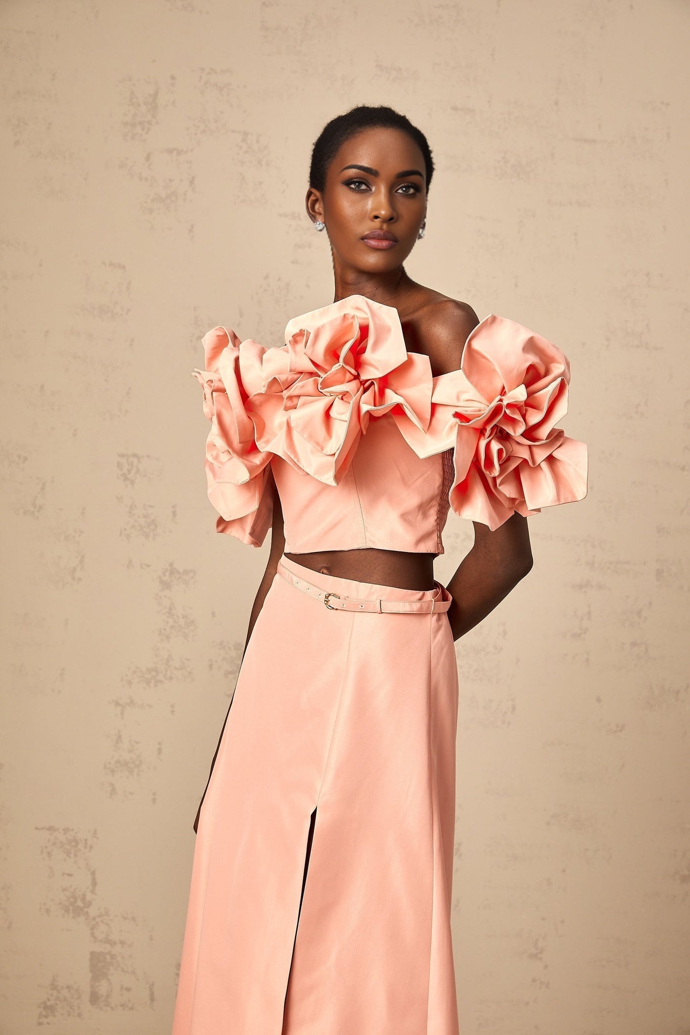 A pink twopiece outfit consisting of a top and skirt with floral applique details Yvette matching set