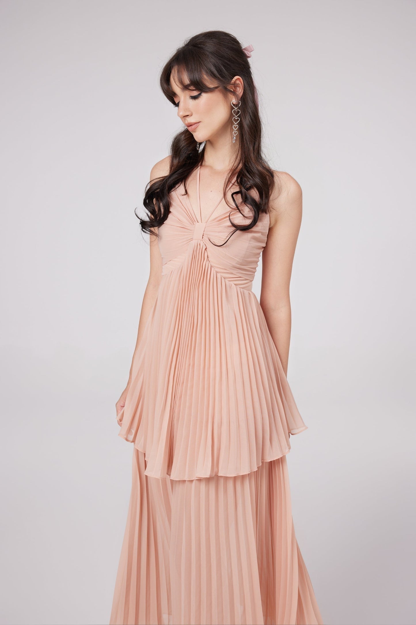 A pleated pink midi dress with tiered layers called Rosa Olympe