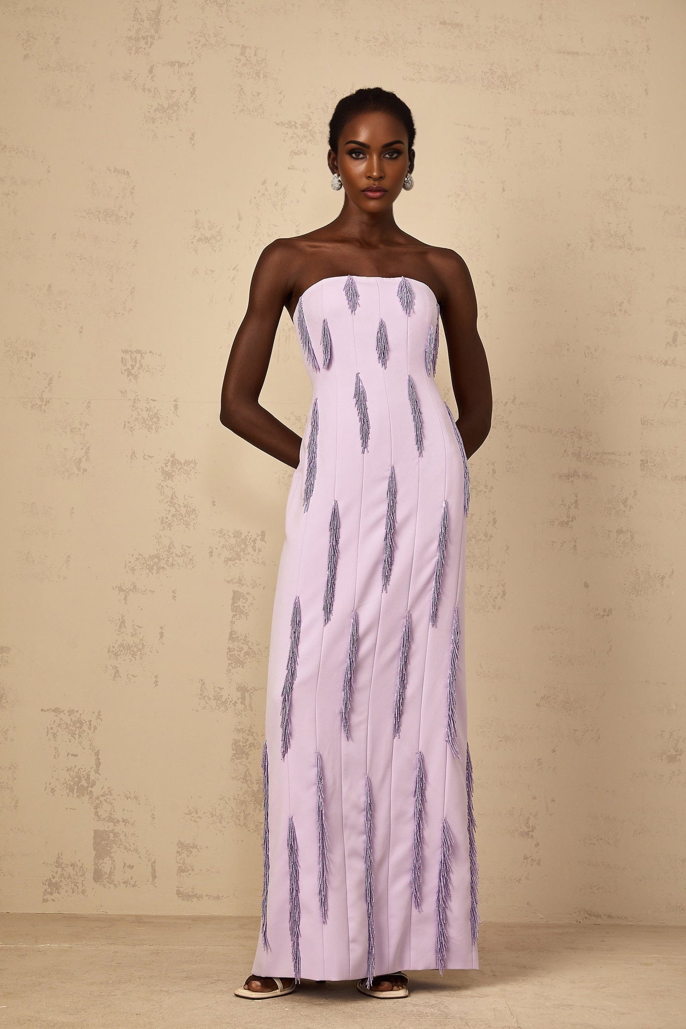 A purple maxi dress with beaded fringe details named Émilie