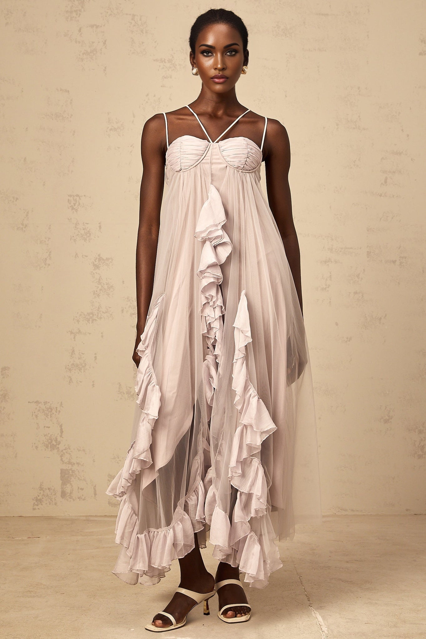 A purple maxi dress with layered ruffled tulle skirt and a sleeveless bodice named Colette