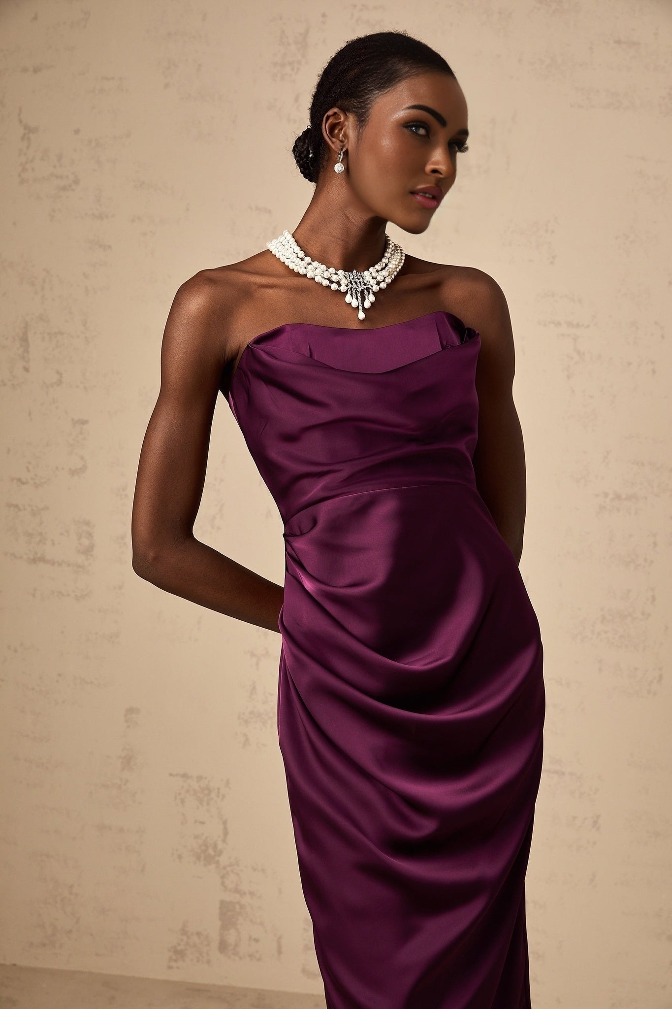 A purple satin midi dress with ruched detailing by Chloé