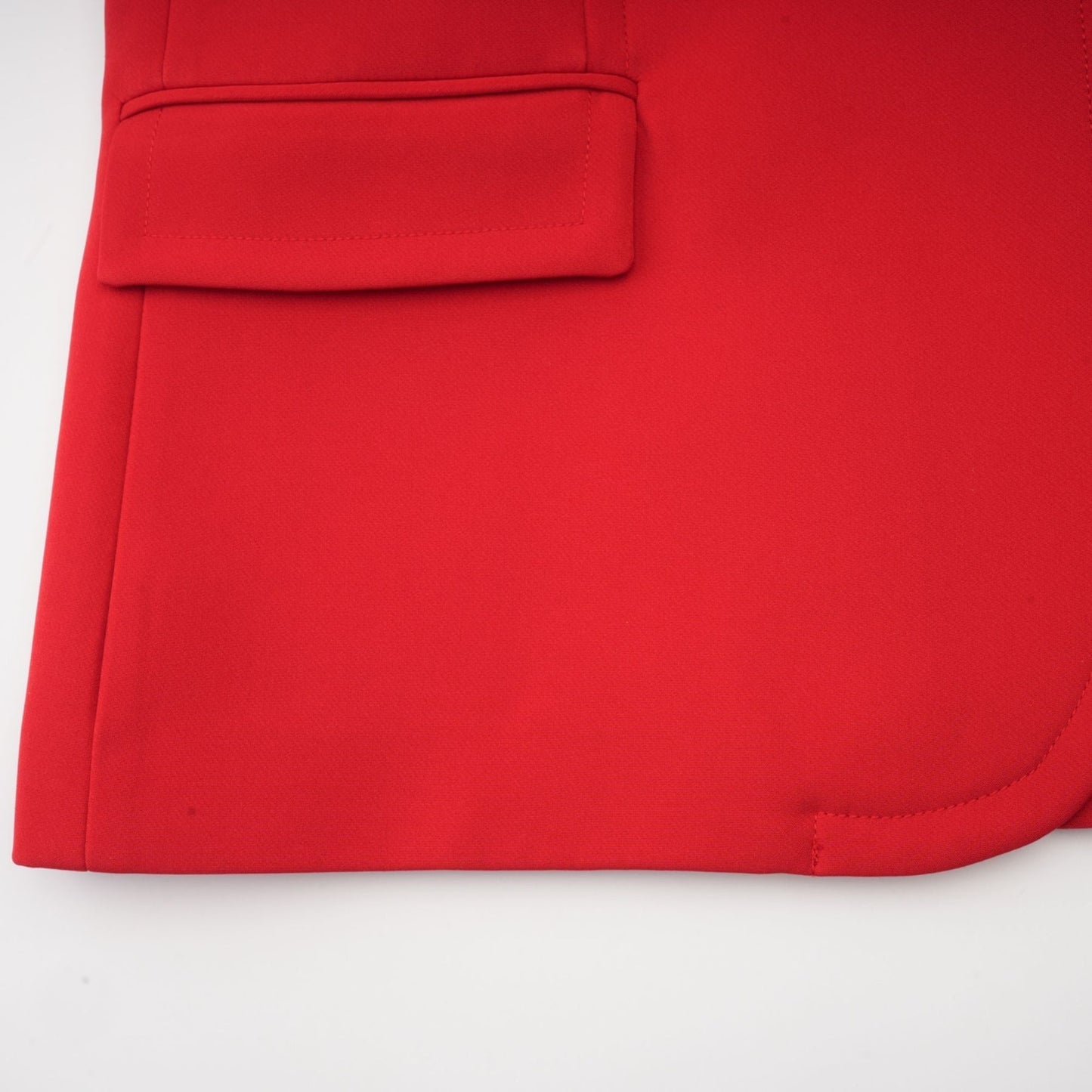 A red blazer with hourglass silhouette and doublebreasted front closure