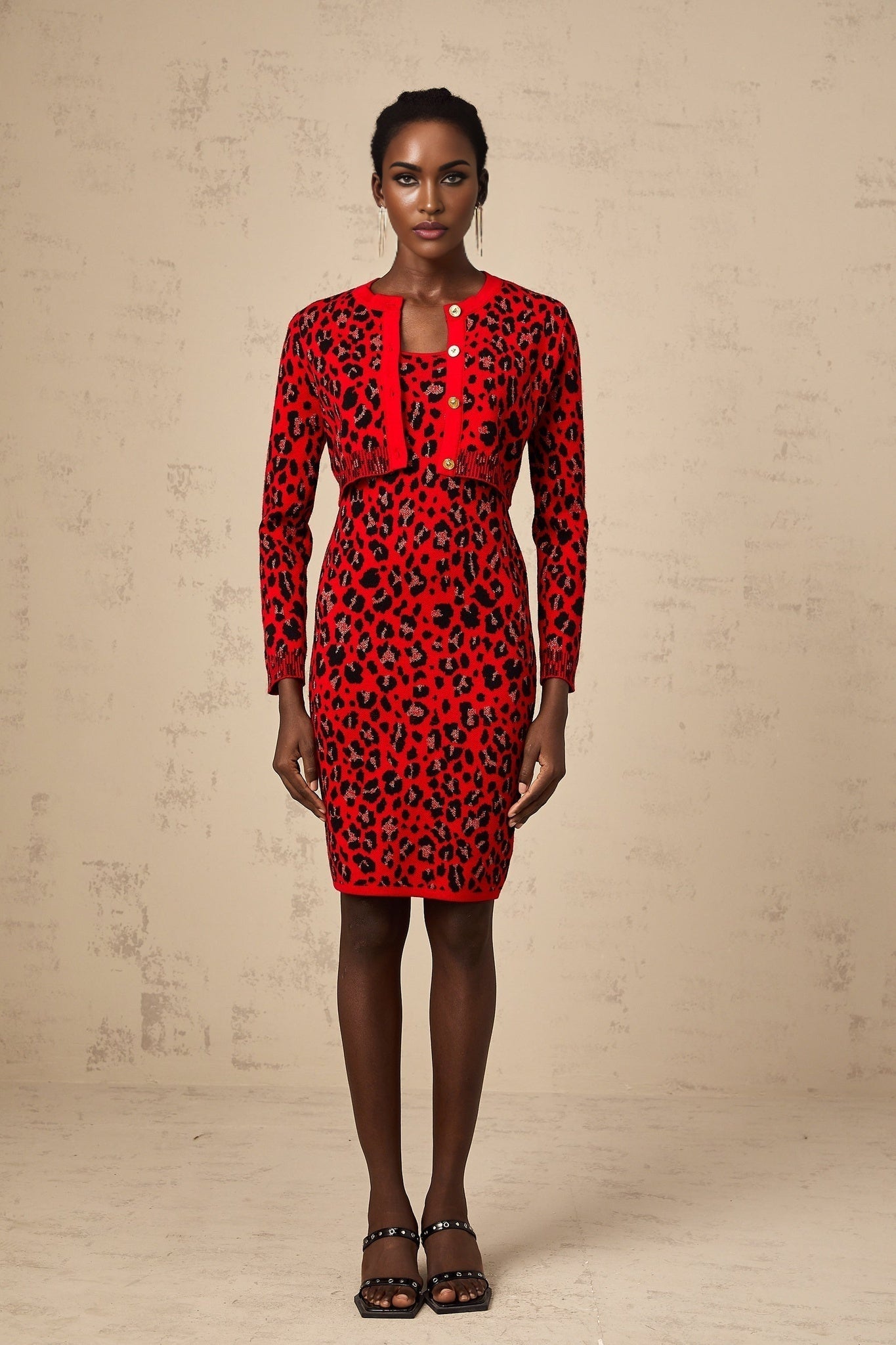 A red cardigan with leopard print pattern made from shimmery lurex fabric