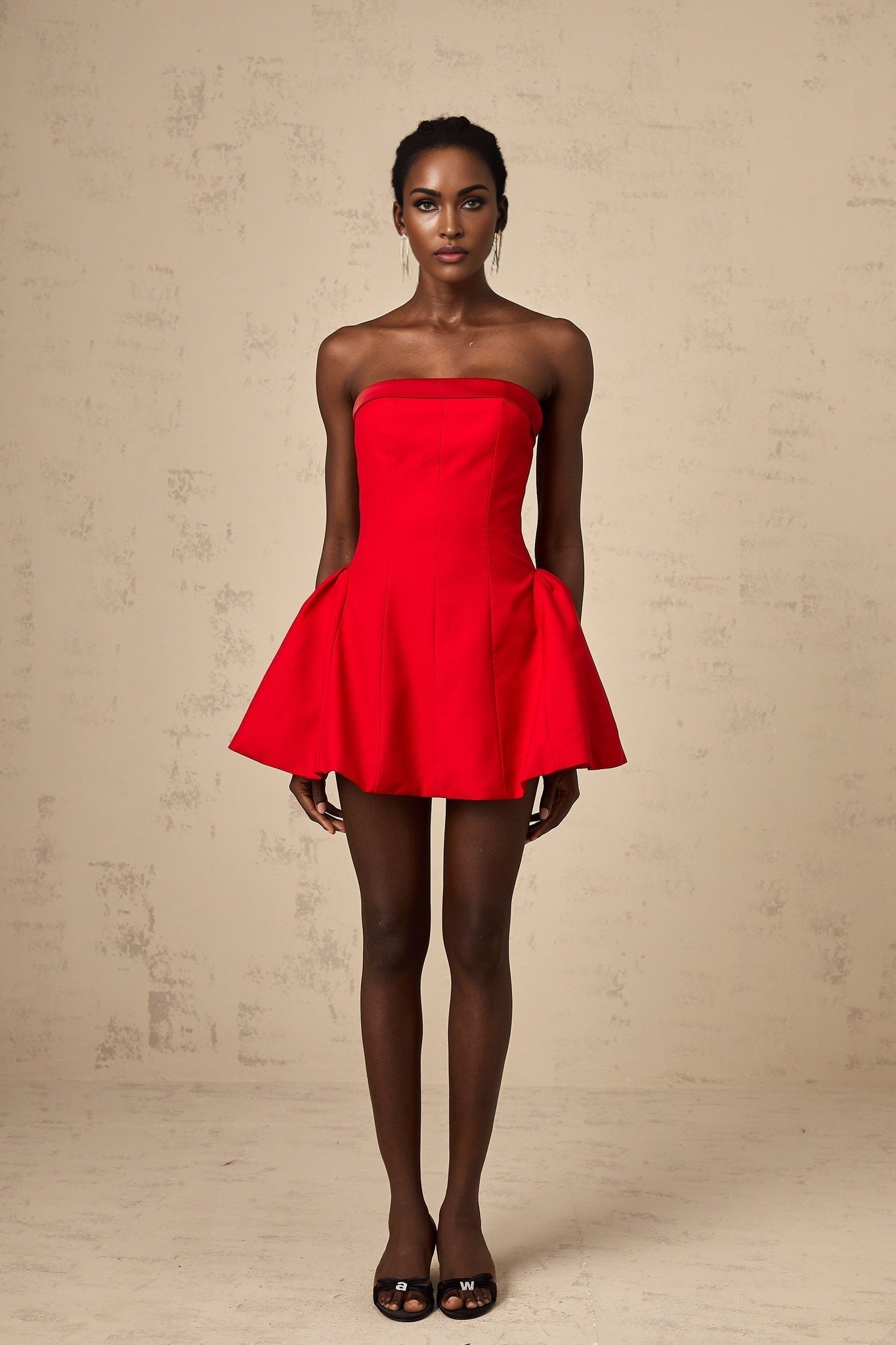 A red offshoulder mini dress with a flared skirt and fitted bodice named Perrine