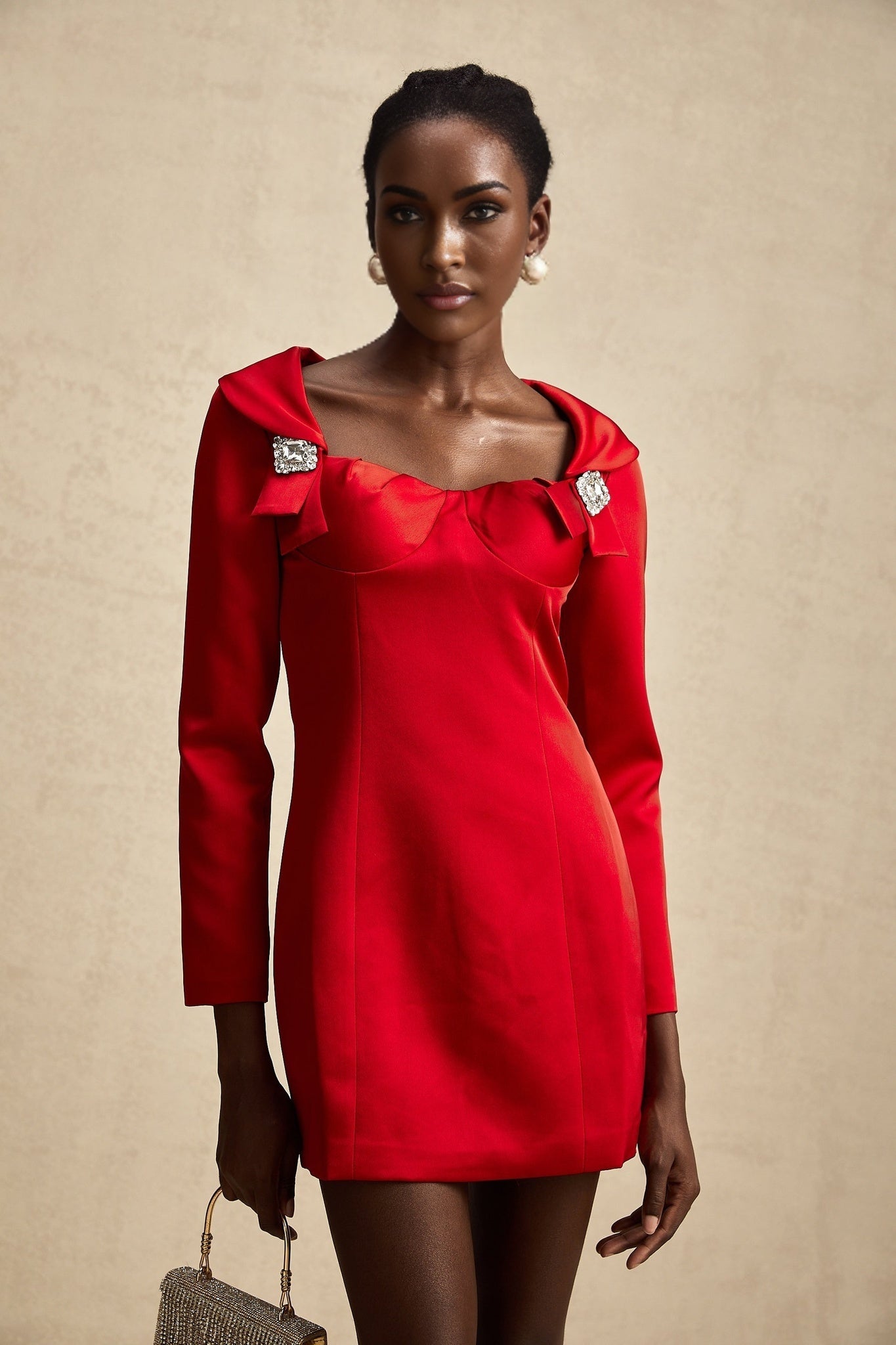 A red satin mini dress by Celine featuring a corset style design