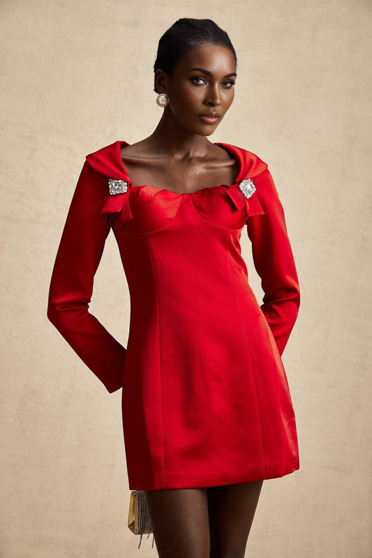 A red satin mini dress in corset style by Celine featuring a fitted bodice and short hemline