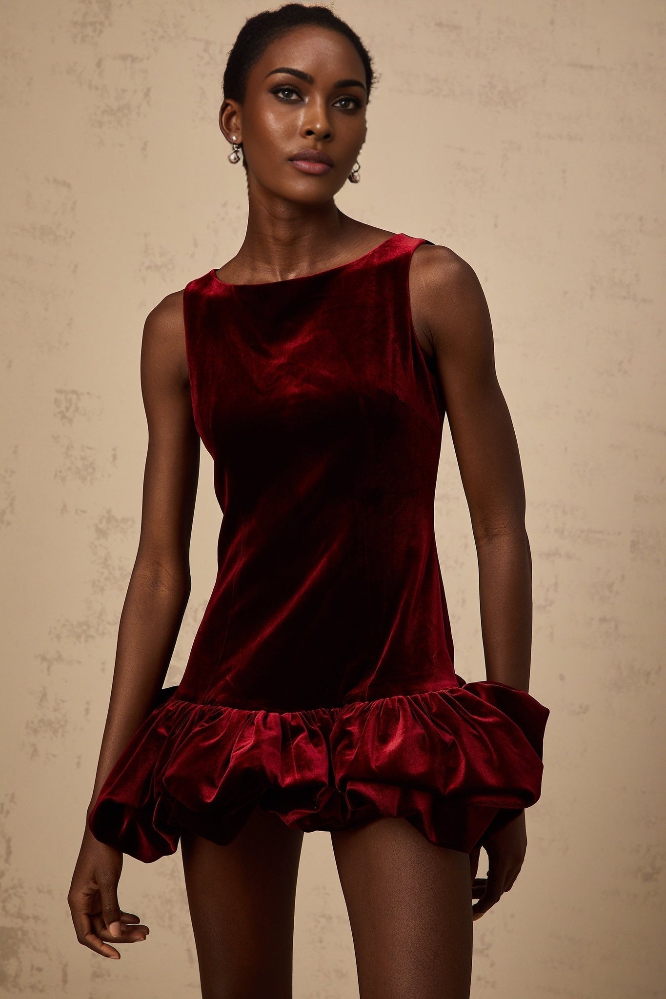 A red velvet mini dress with a peplum hem detail named Marion