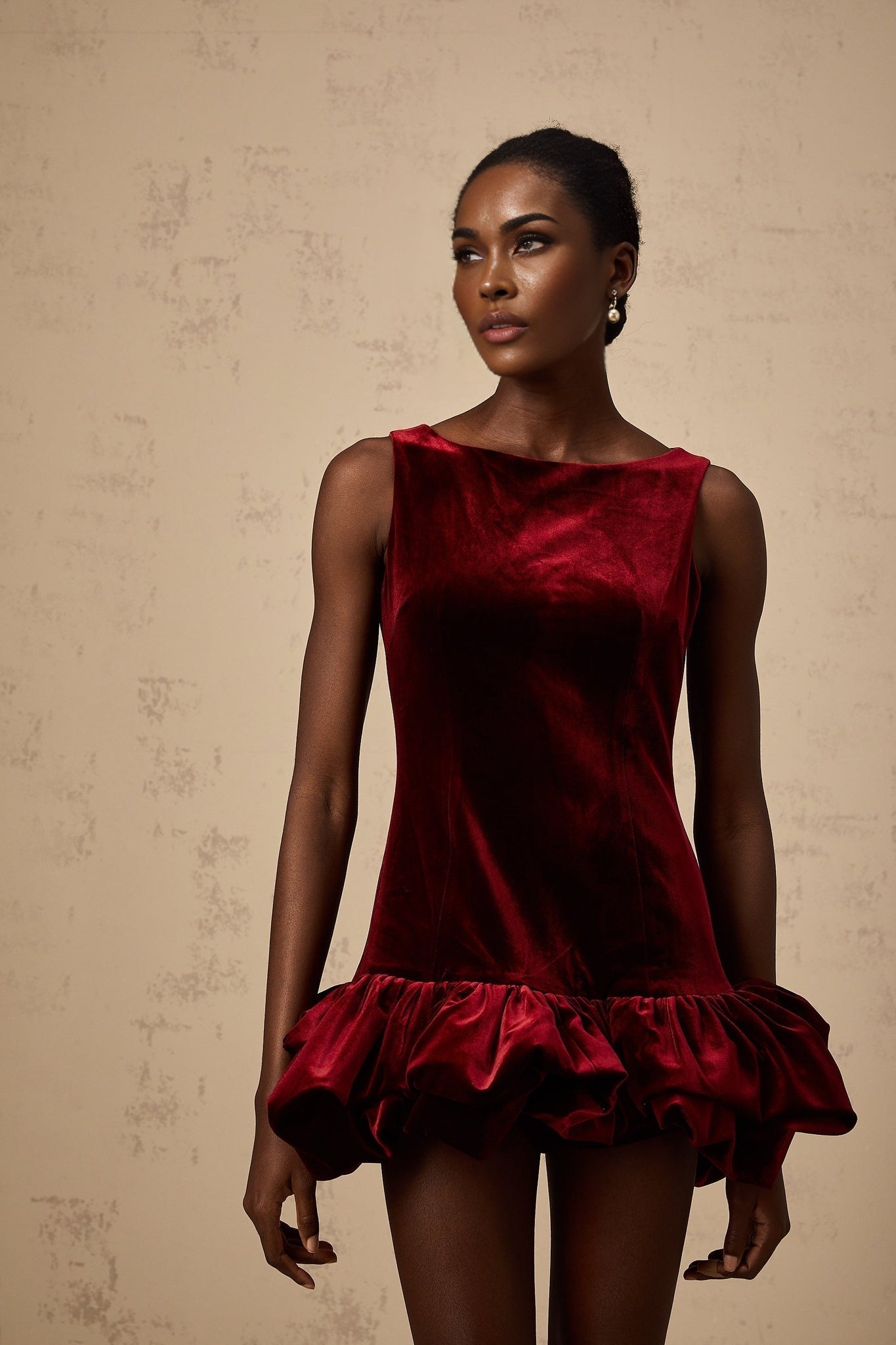 A red velvet mini dress with a peplum hem named Marion