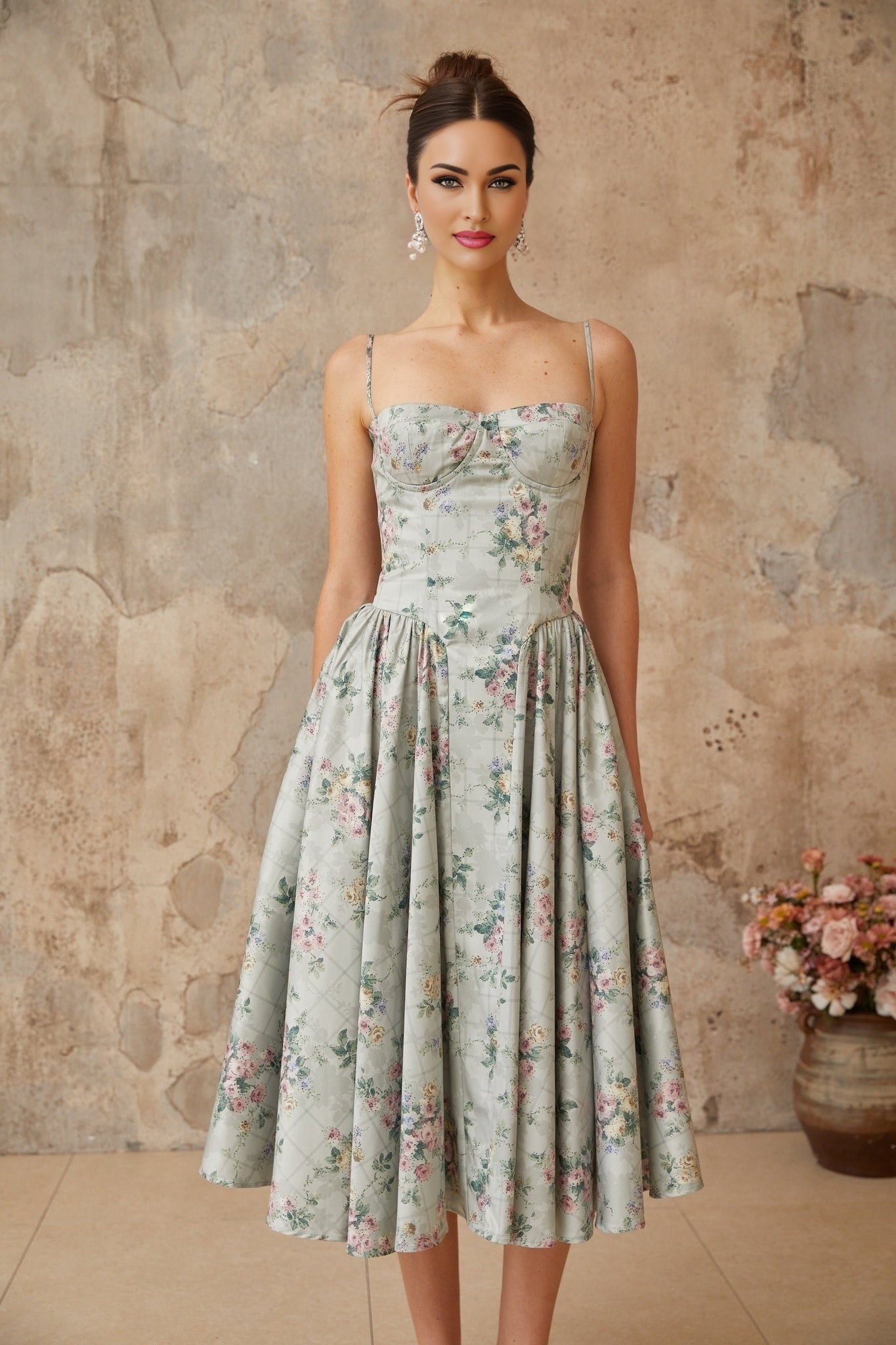 A sagegreen midi dress with a floral print pattern and shirred detailing called Prunelle
