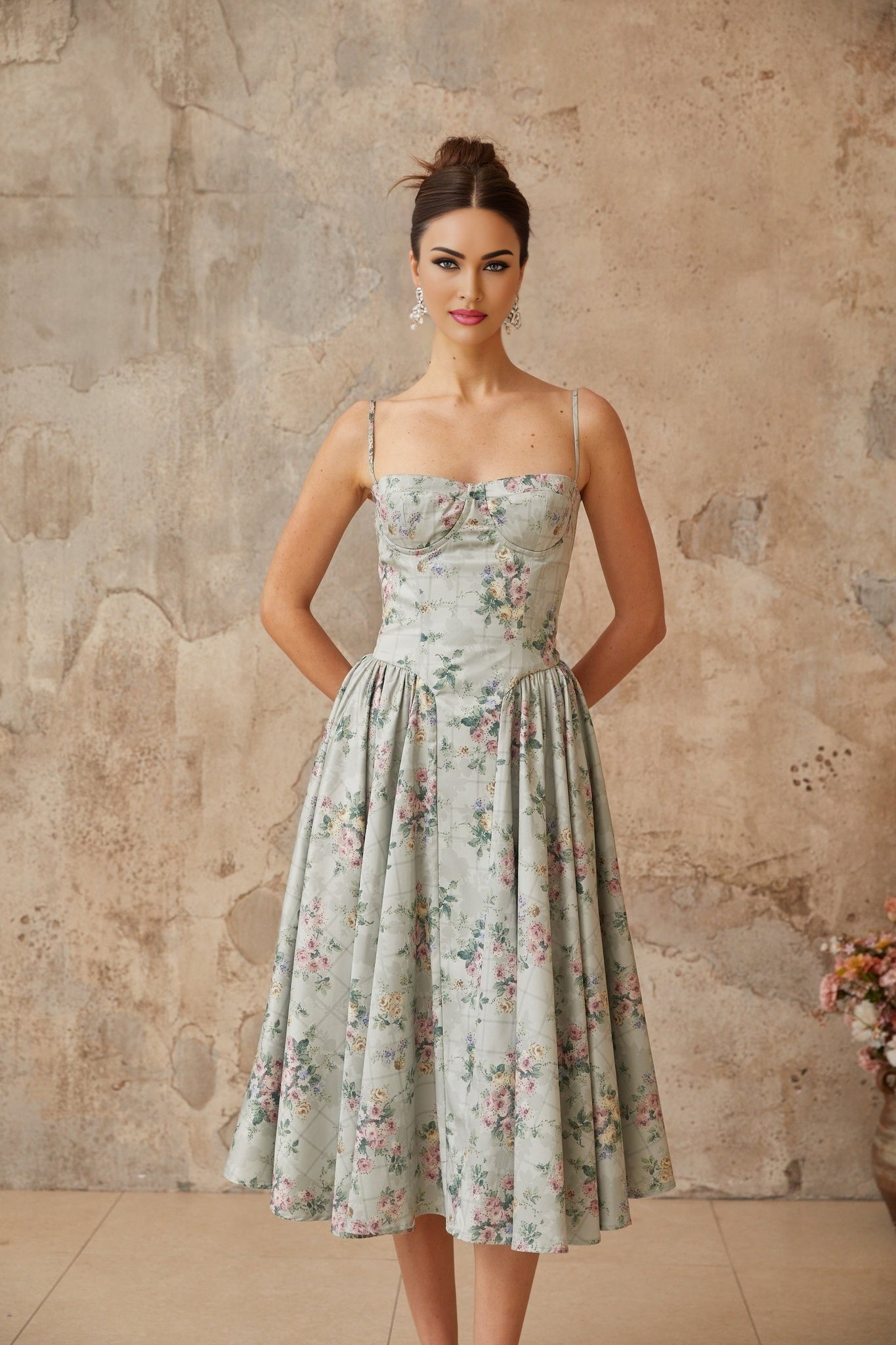A sagegreen midi dress with a floral print pattern and shirred detailing named Prunelle