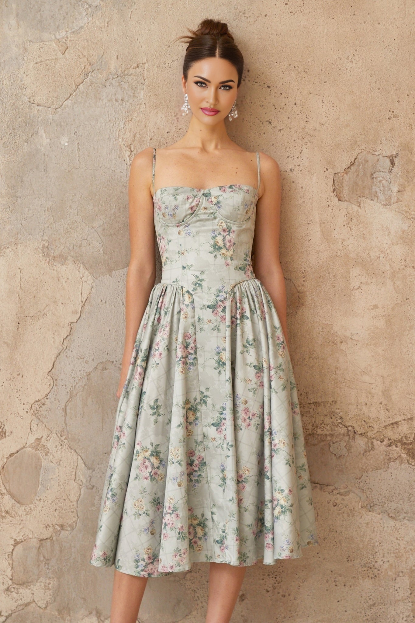 A sagegreen midi dress with a floral print pattern and shirred detailing named Prunelle