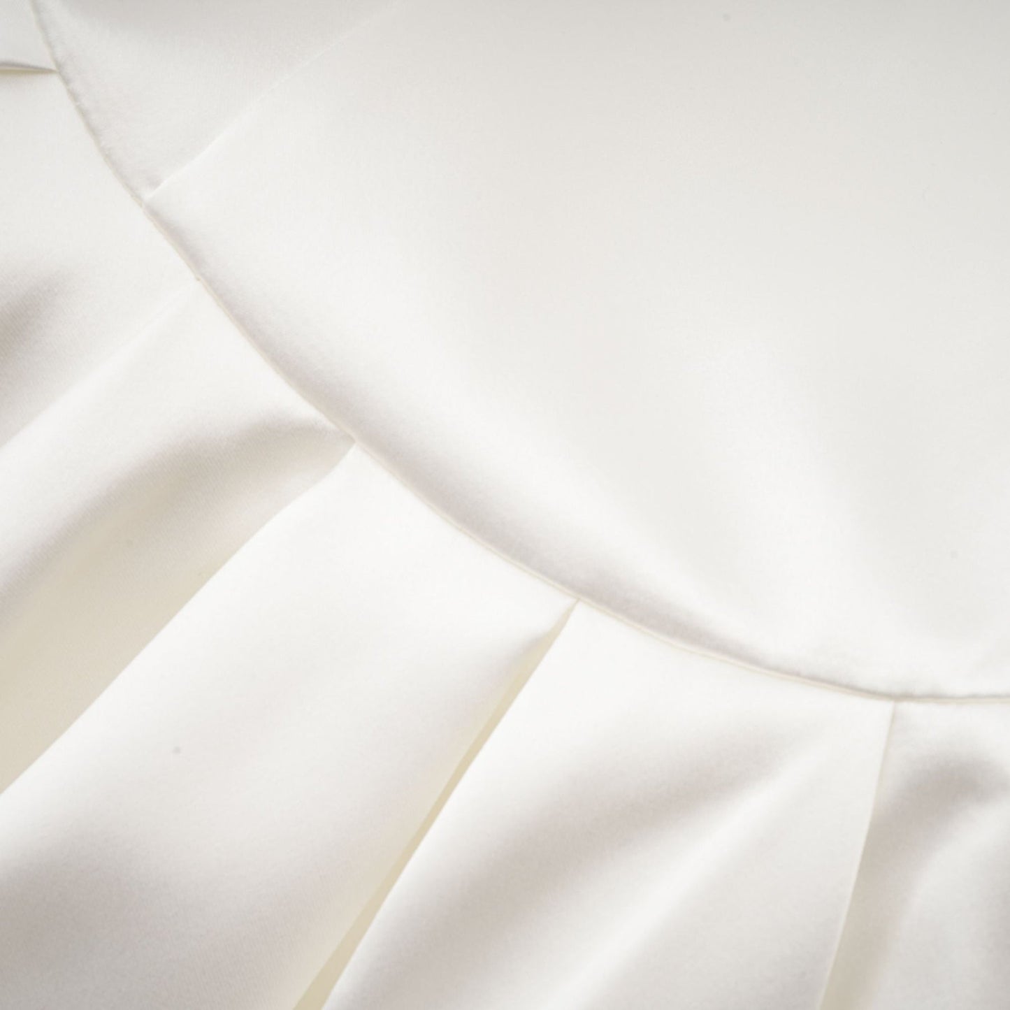 White satin dress with square neck spaghetti straps and asymmetric hem sleeveless and thigh length rear zip fastening 56% Polyester and 44% Acetate