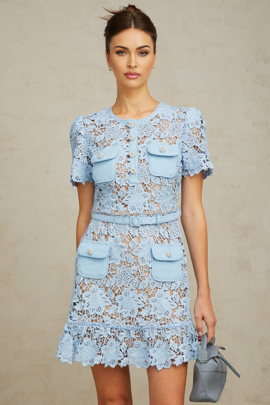 A short blue lace mini dress with ruffled details and floral applique decorations