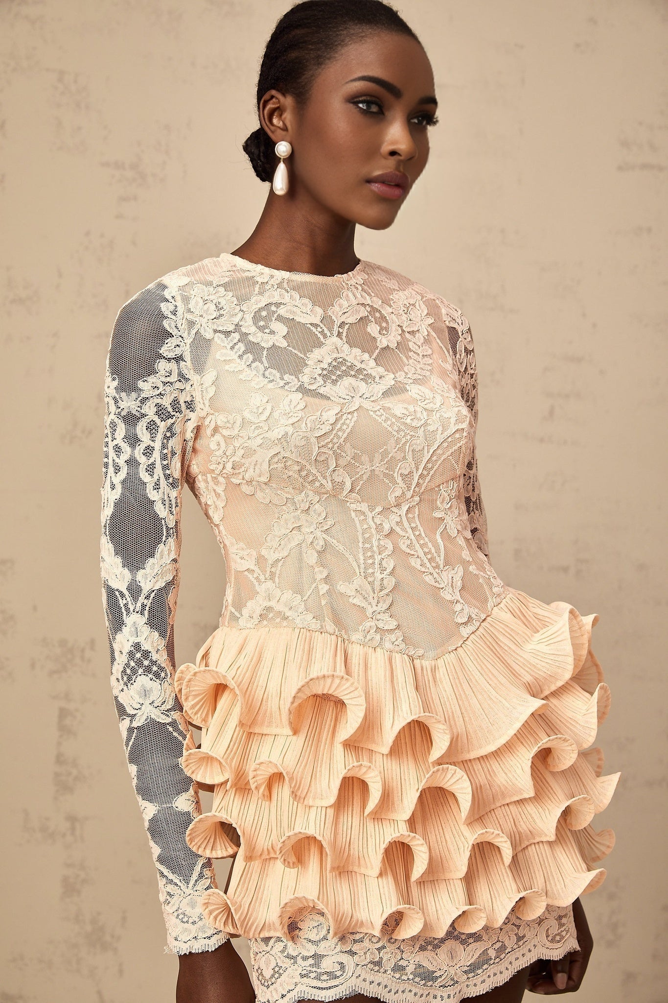 A short floral lace mini dress with tiered layers and sheer lace panels named Irene featuring a feminine and romantic design