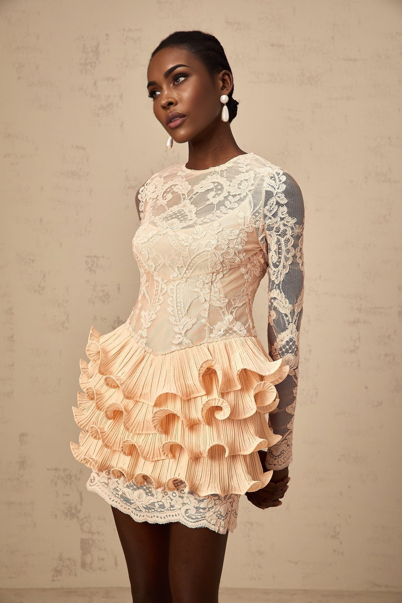 A short floral lace mini dress with tiered skirt and lace paneling details named Irene