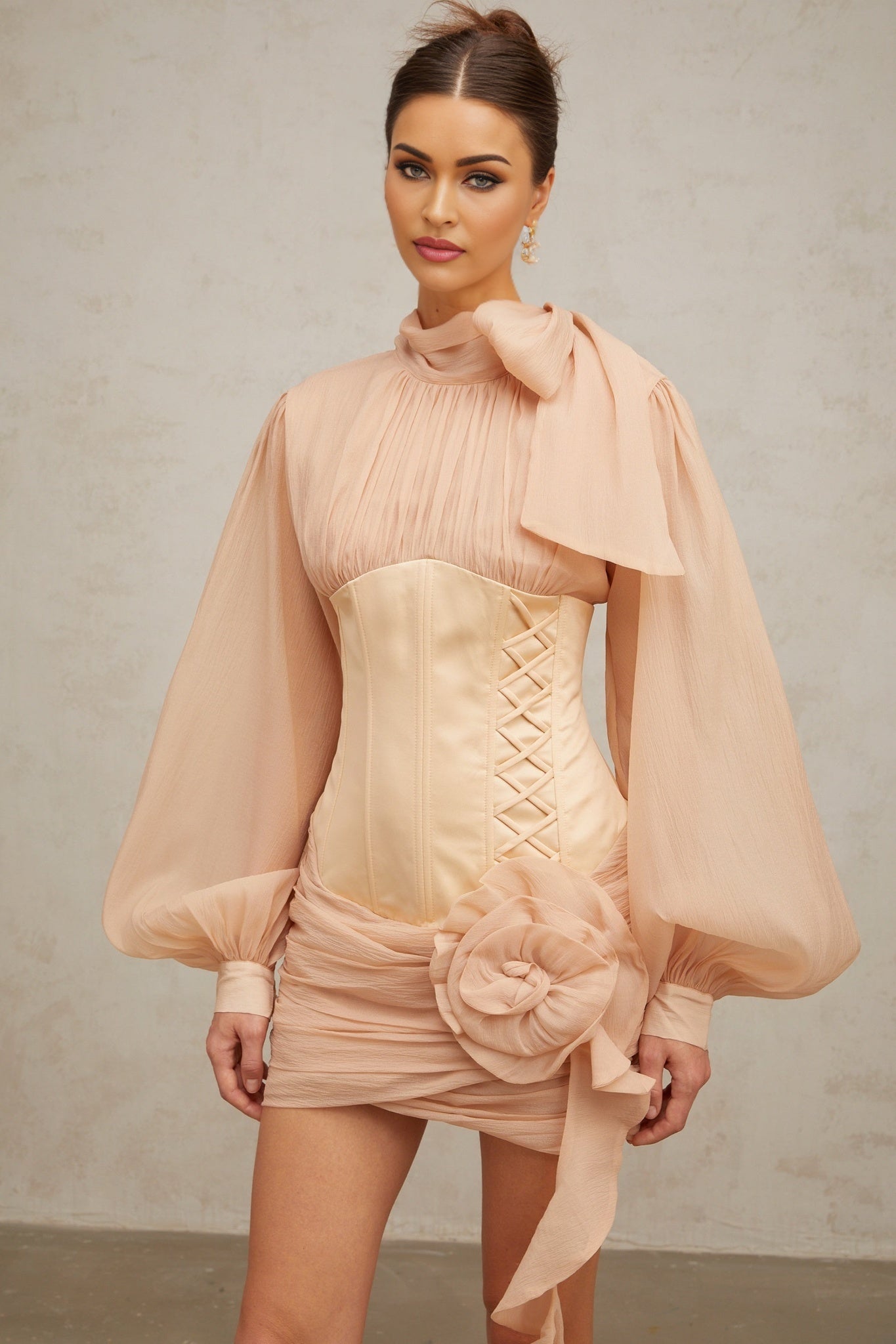 A short floral mini dress with cinched waist and applique details featuring paneled construction in a feminine silhouette