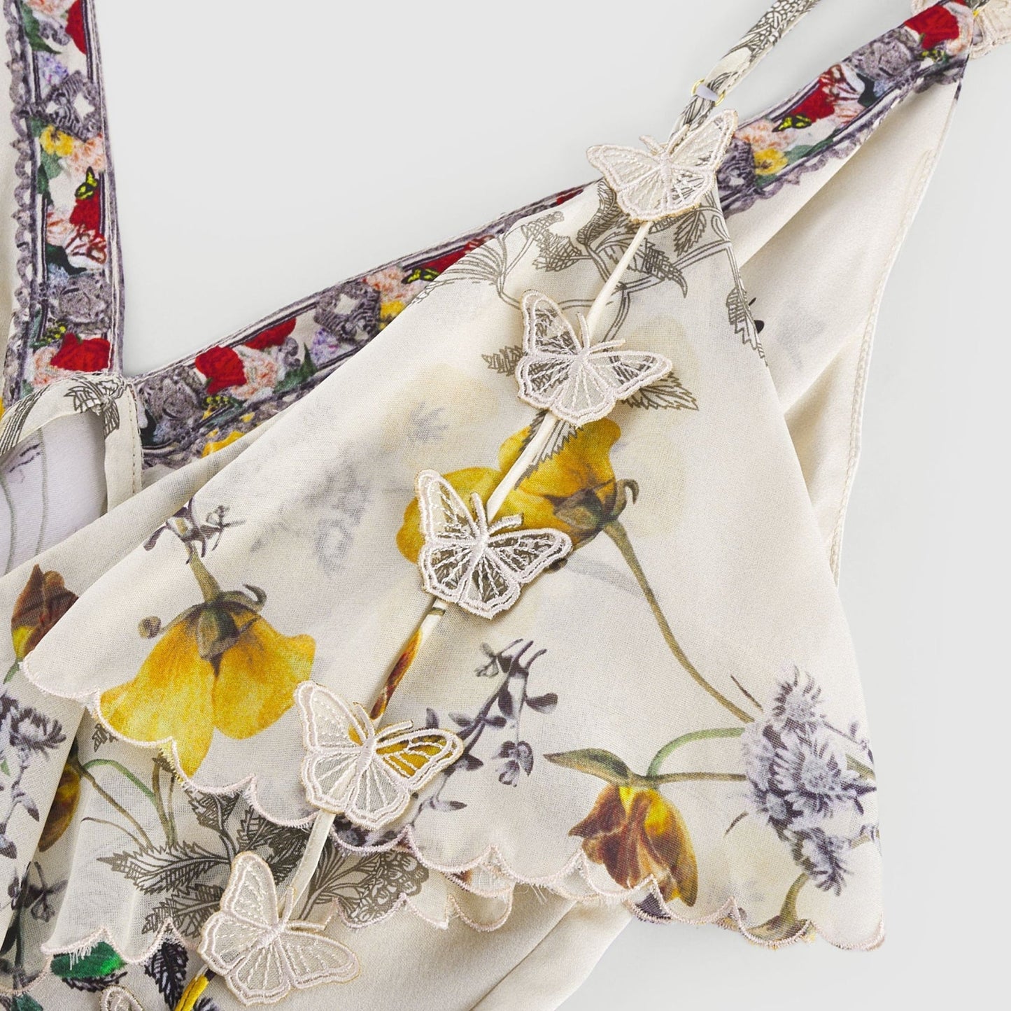 Soft neutral mini dress with multicolor butterfly motif V neck spaghetti straps and floral print on luxurious silk fabric