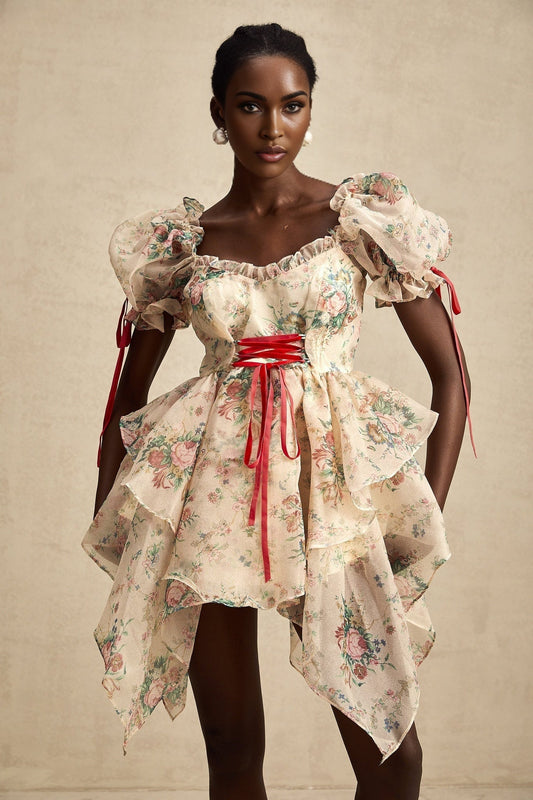 A short floral print mini dress with layered tulle skirt and tie up detail named Salome