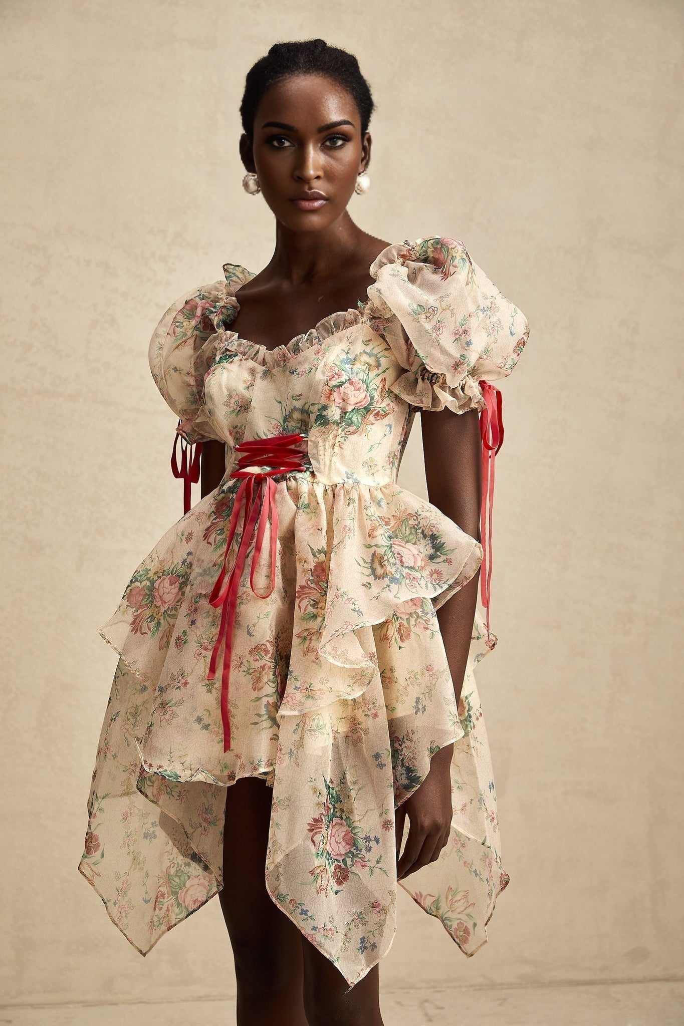 A short floral print mini dress with layered tulle skirt and tieup details named Salome