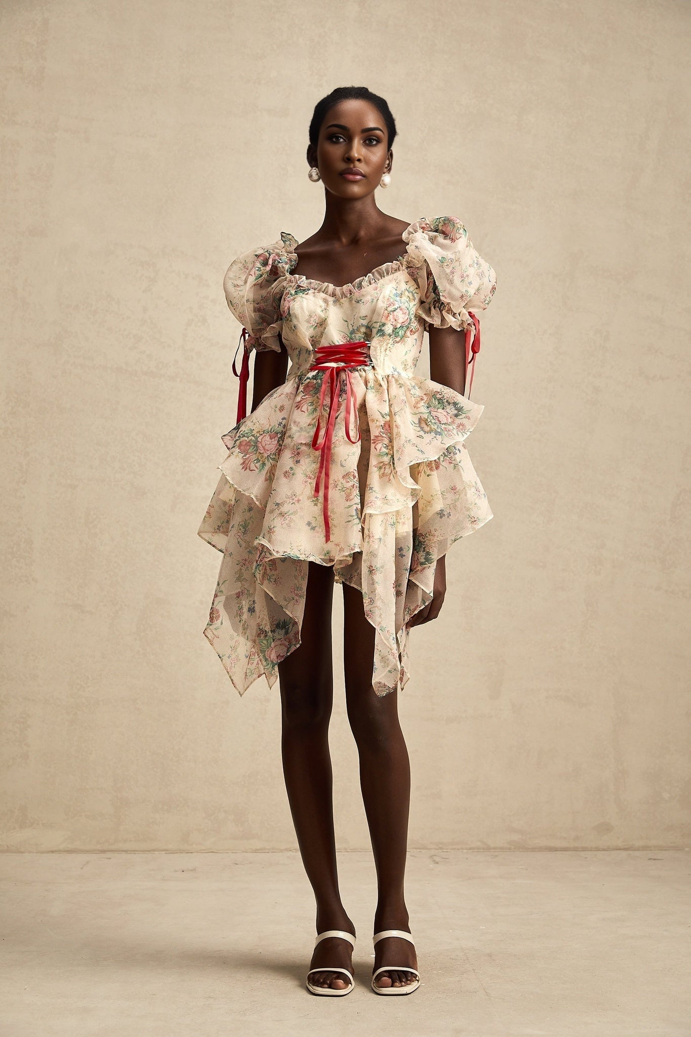 A short floral print mini dress with layered tulle skirt and tieup details named Salome