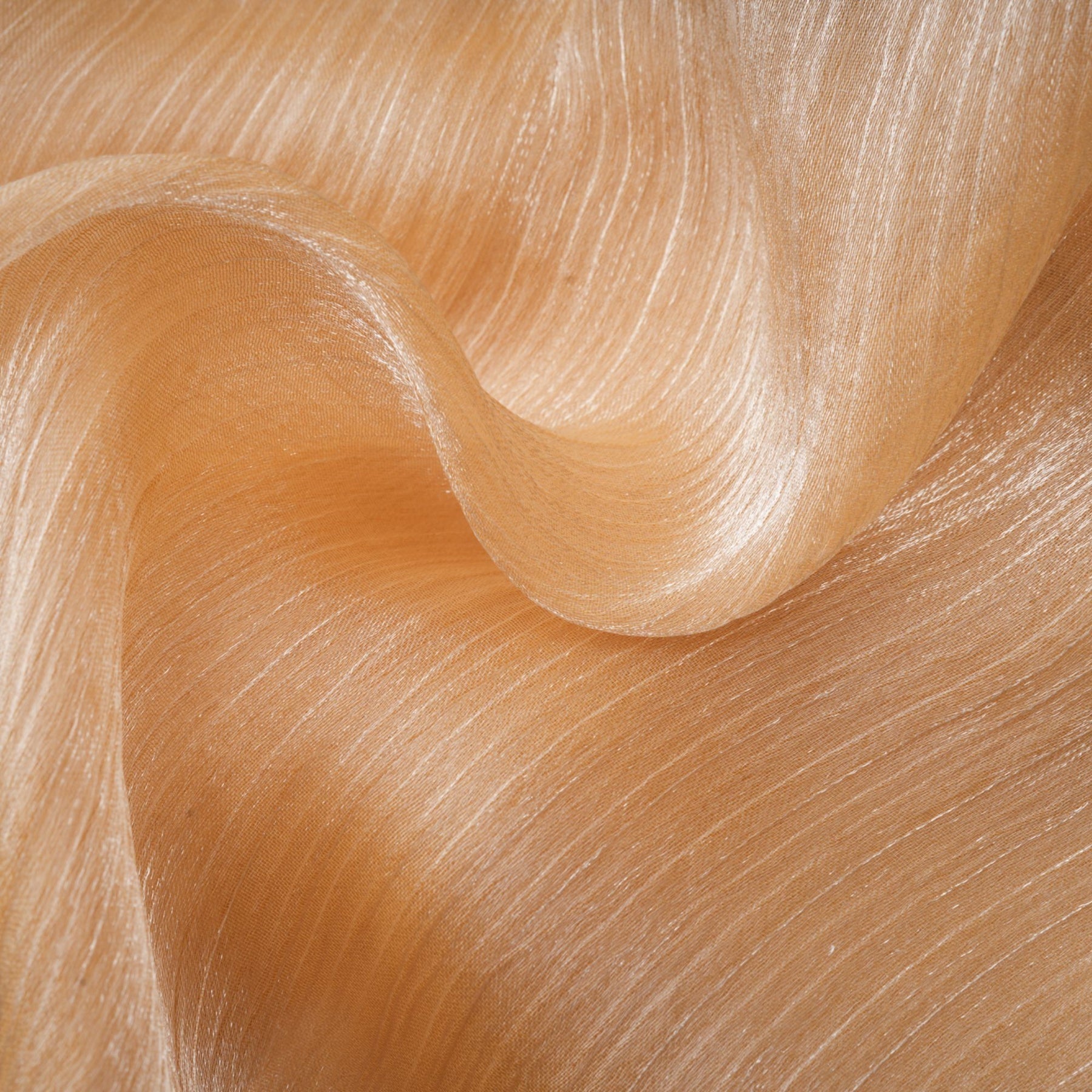 A short gold mini dress with crystal embellishments and panels featuring a shimmering design and intricate detailing