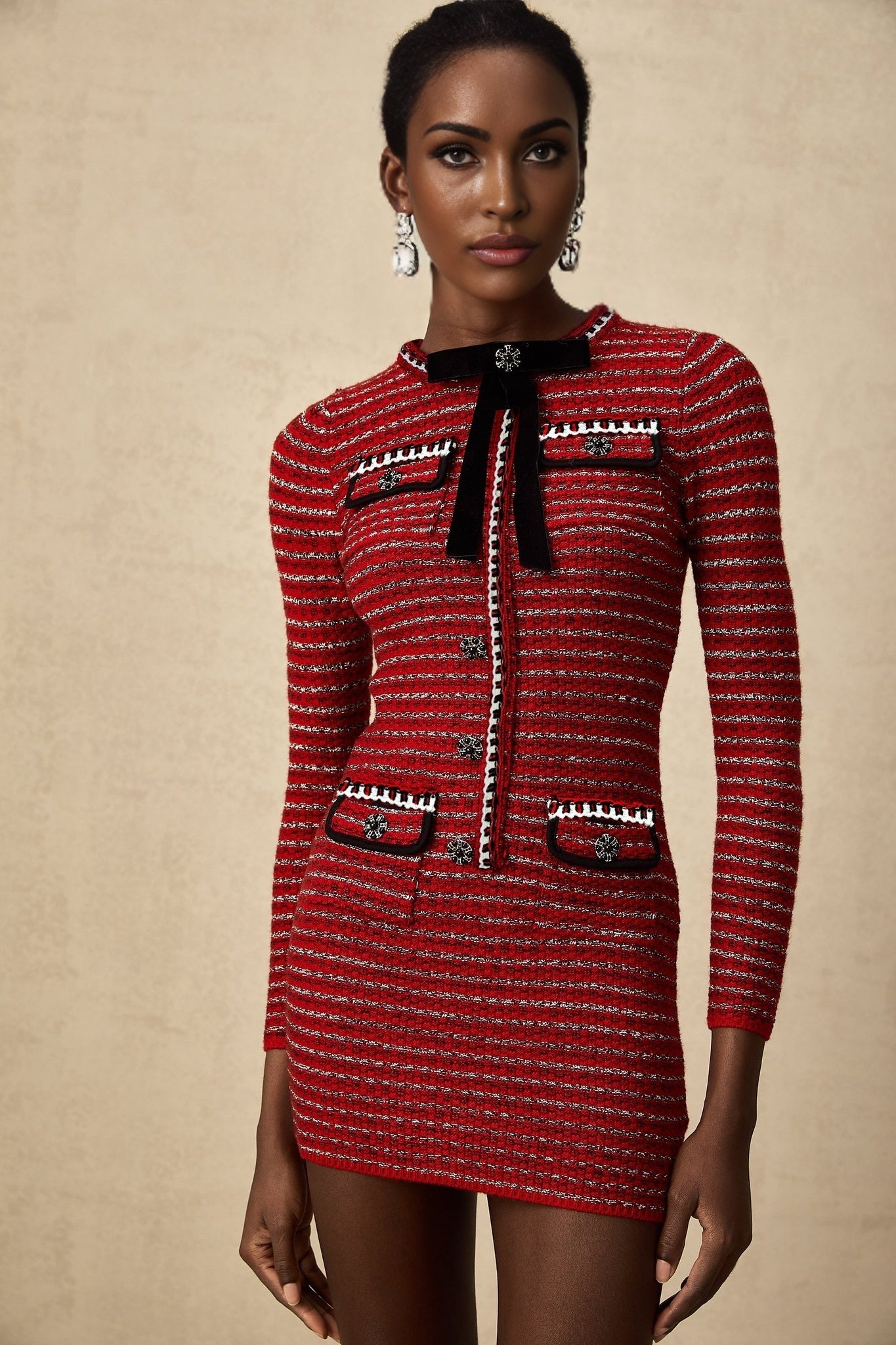 A short knit mini dress with a bow detail named Faustine