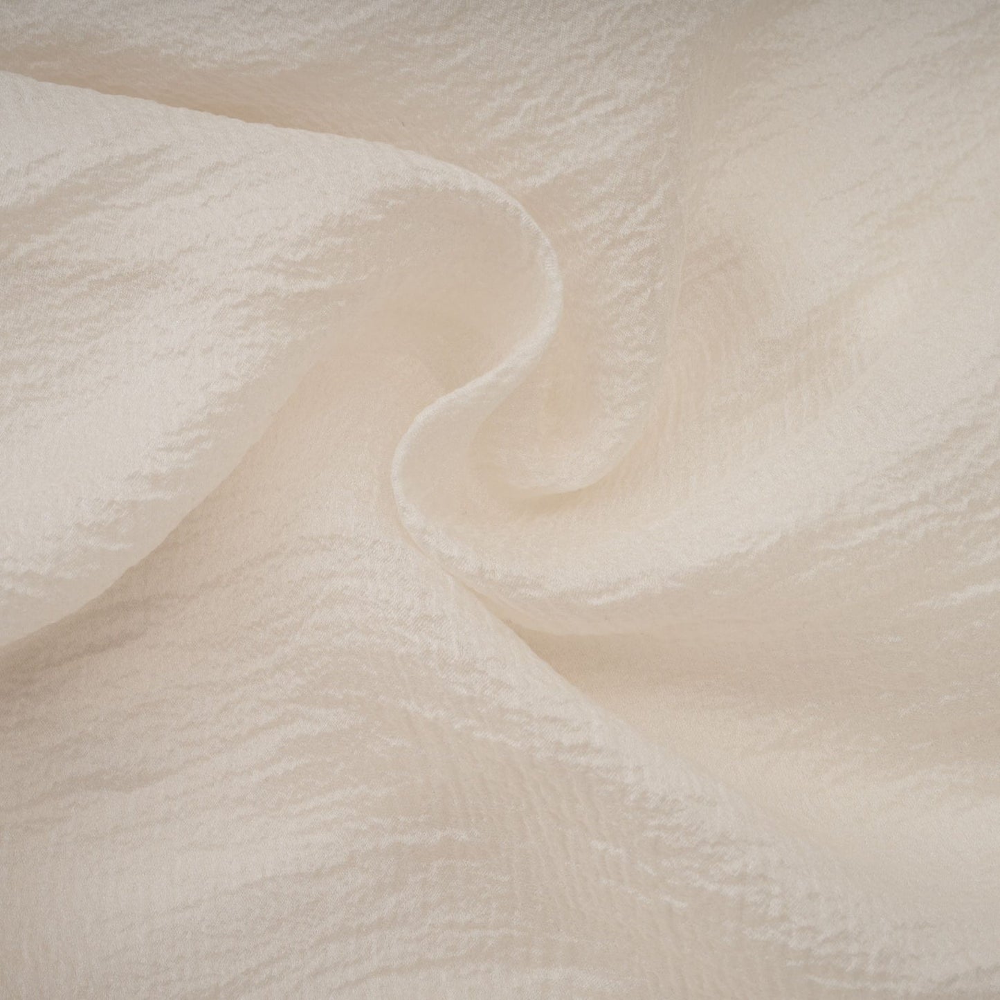 A short neutral colored mini dress with tiered skirt and floral applique details named Zephyrine