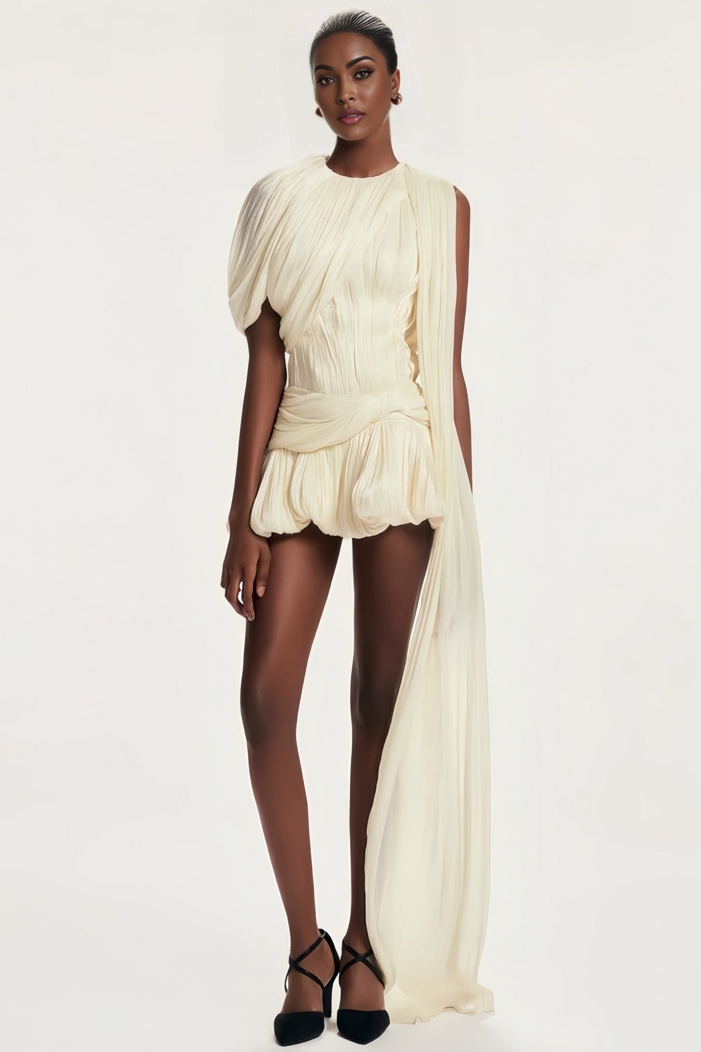 A short pleated mini dress with ribbon design details likely in a feminine style named Cyrielle