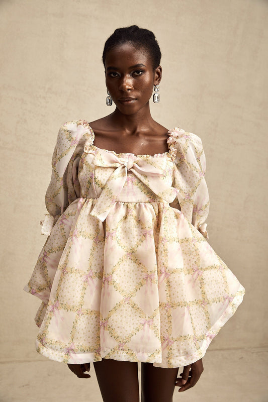 A short puffy mini dress with a check pattern and a prominent bowknot detail featuring a design inspired by Lou style