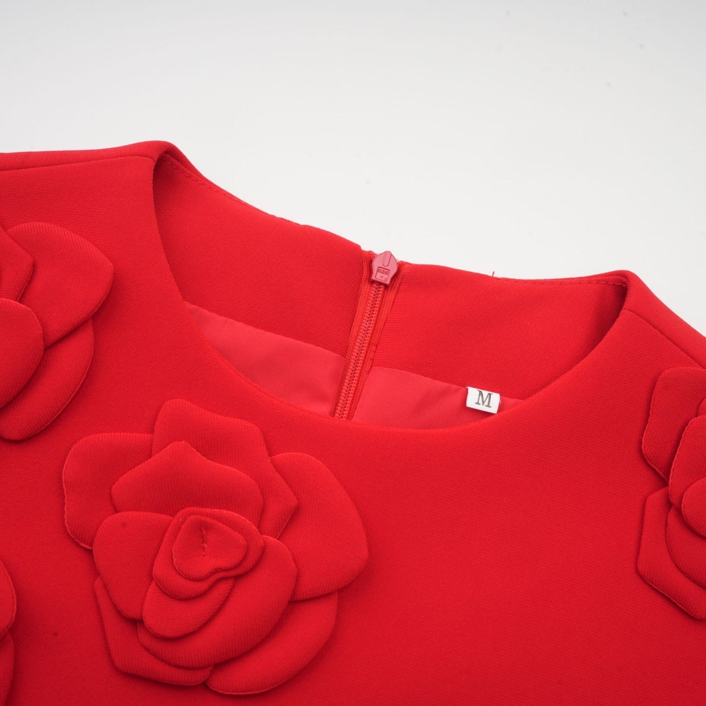 A short red mini dress with floral details and short sleeves