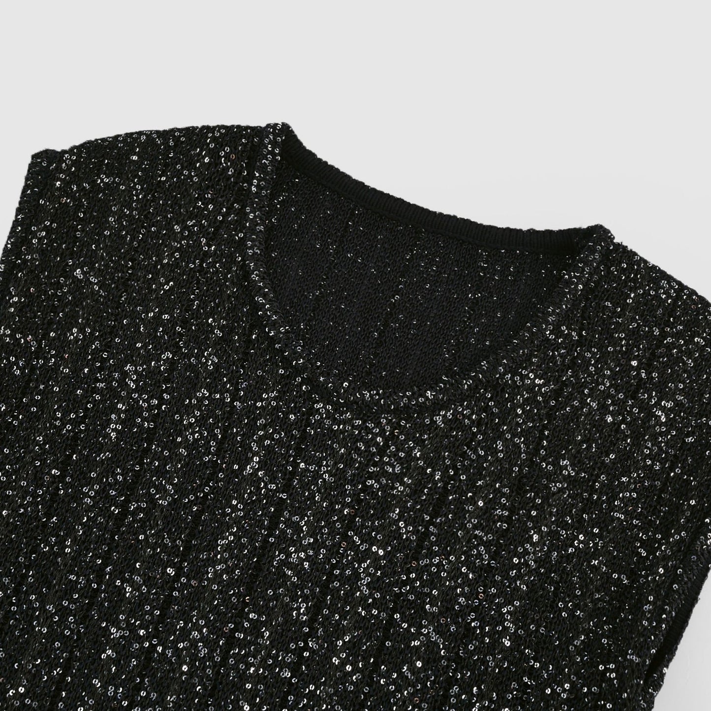 Black sleeveless dress with round neck tiered skirt and sequin detailing Knitted design with mini length made of 50% Viscose 32% Polyamide 15% Terylene 3% Elastane