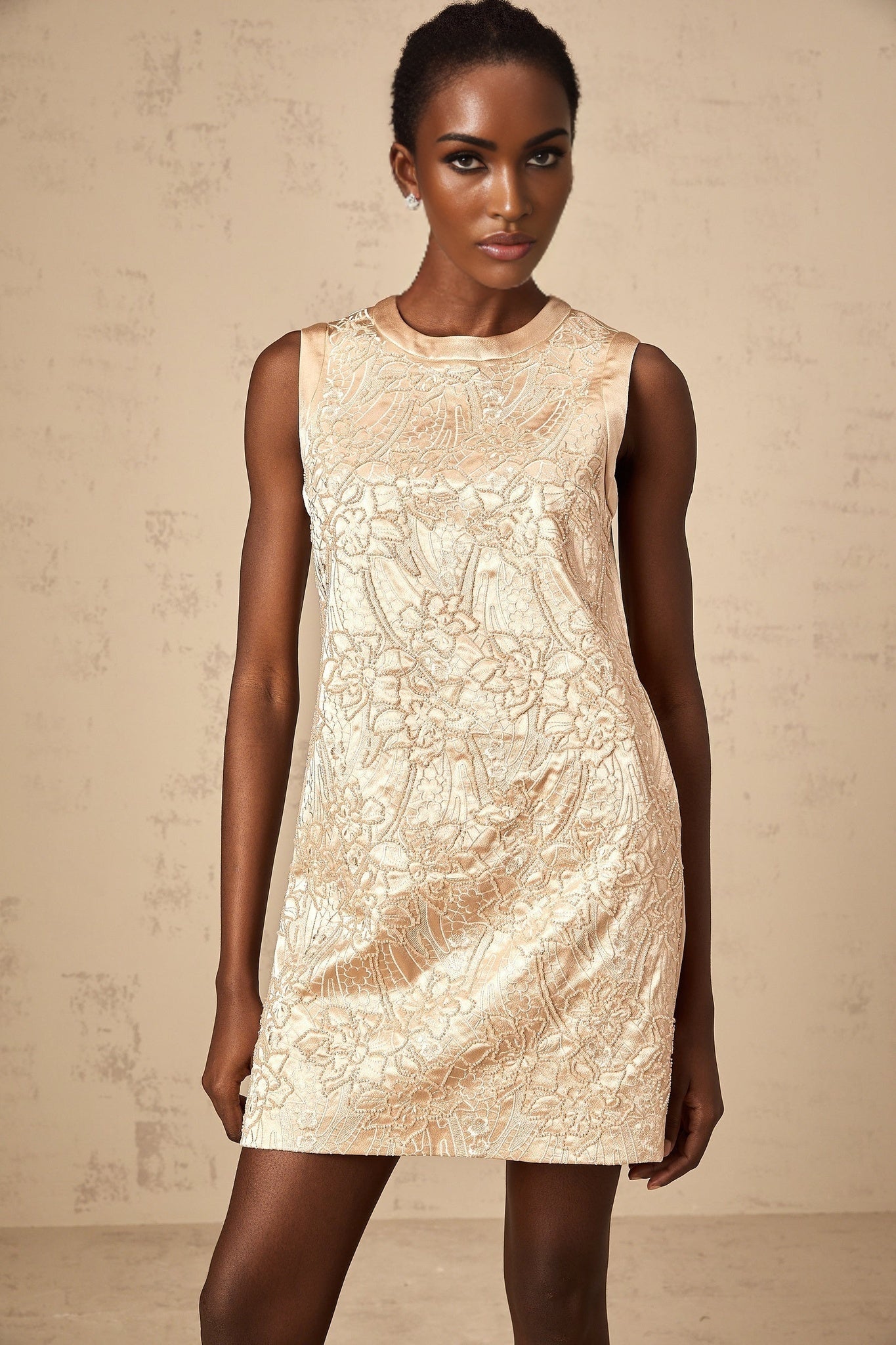 A short sleeveless mini dress with intricate embroidery and beaded embellishments named Isabelle