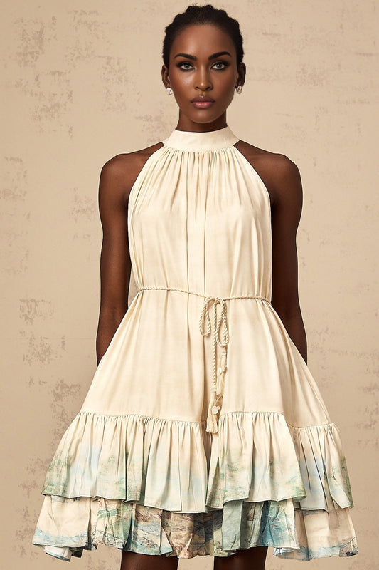 A short sleeveless mini dress with multiple layers featuring a vibrant pattern print in various colors and a flowy silhouette