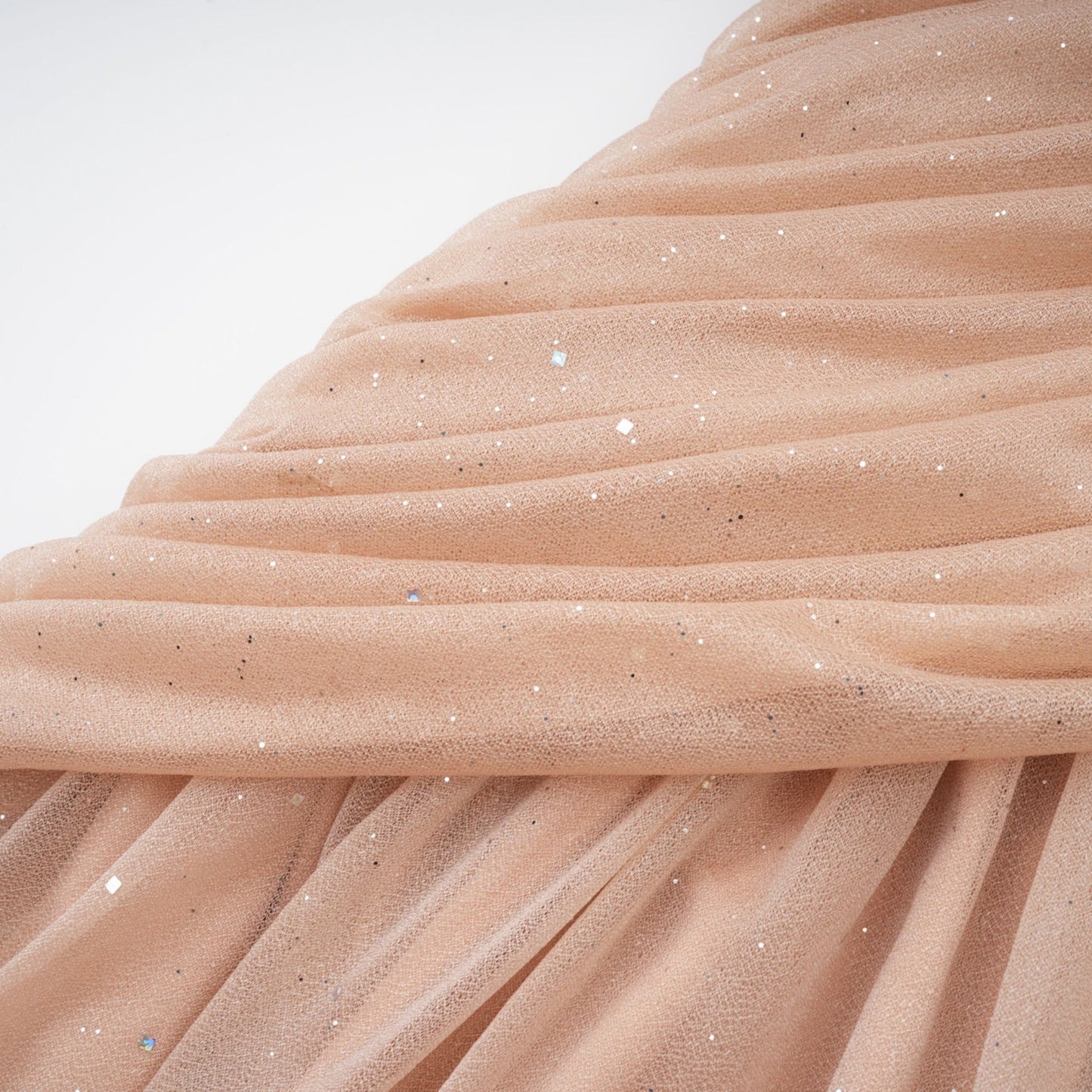 Sleeveless neutral dress with crystal embellishment ruched details and flared skirt